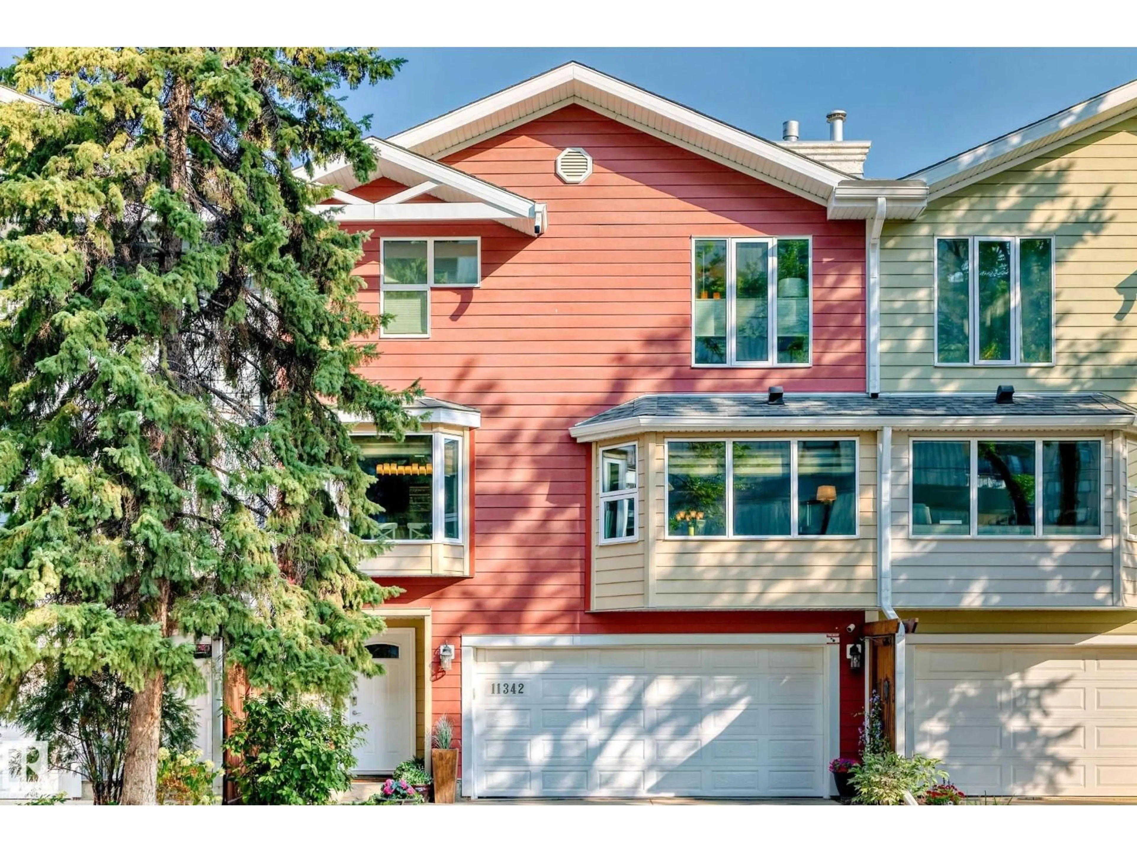 Home with vinyl exterior material, street for 11342 102 AV, Edmonton Alberta T5K0P7