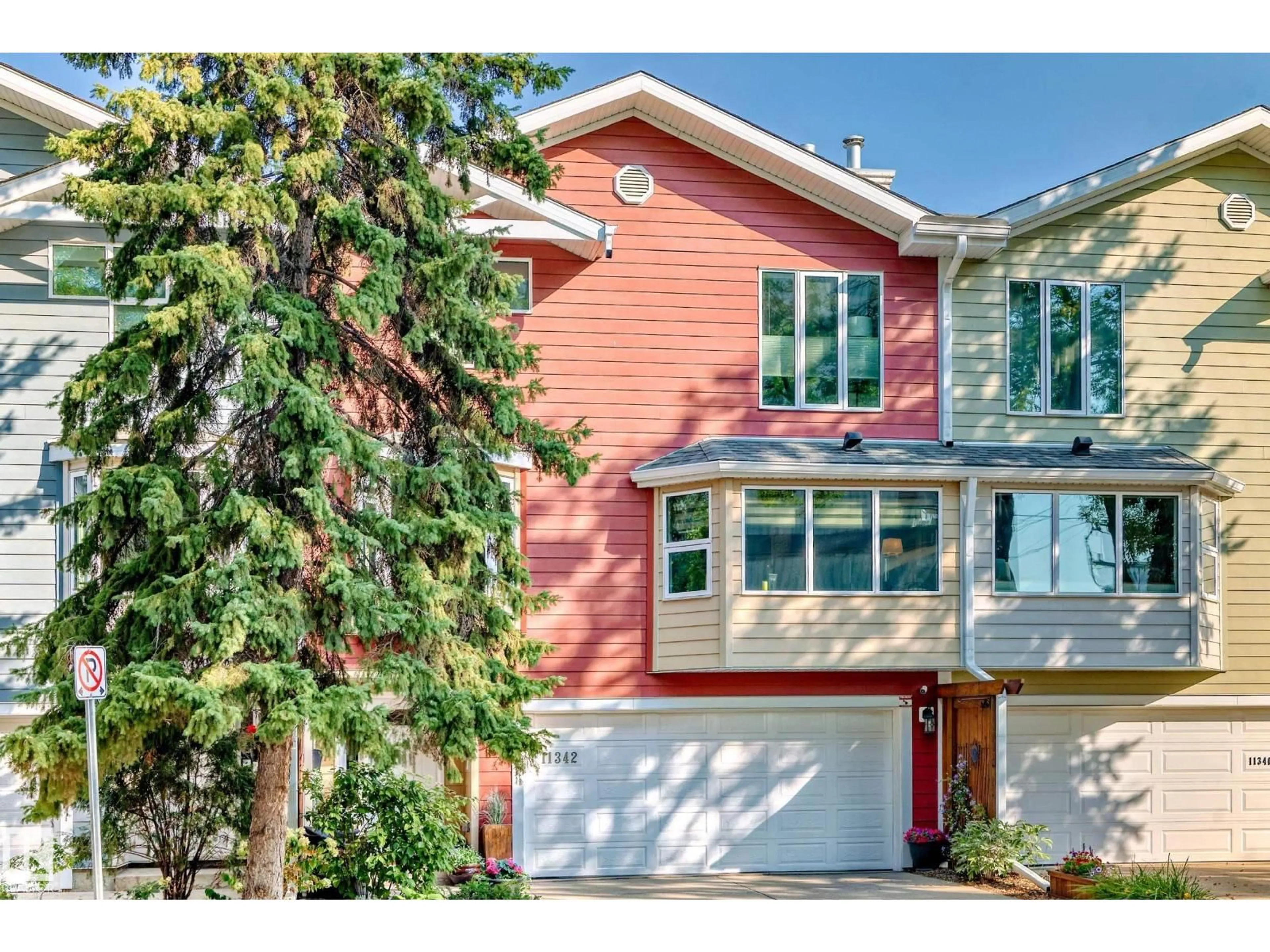 Home with vinyl exterior material, street for 11342 102 AV, Edmonton Alberta T5K0P7