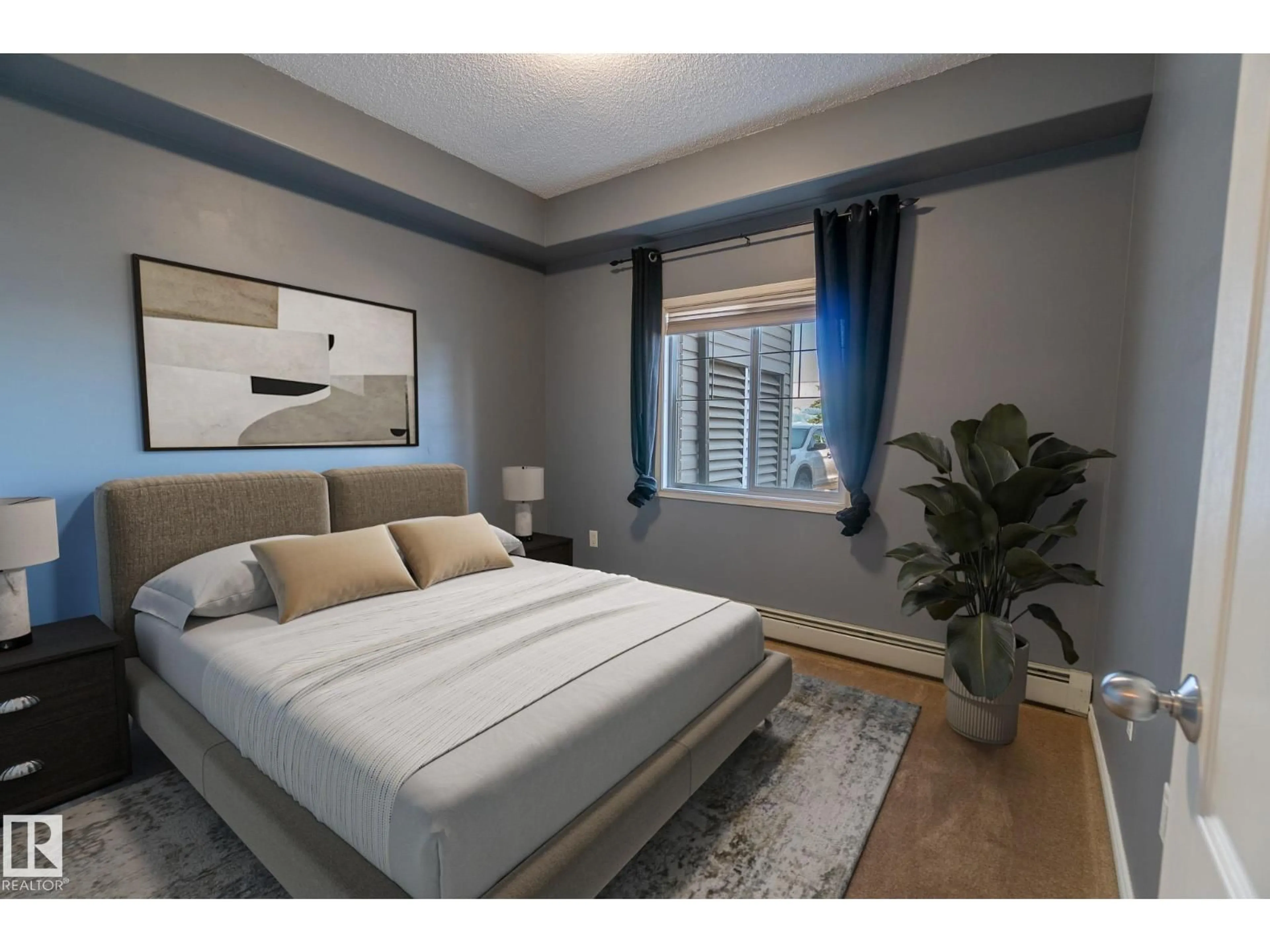 Bedroom with bed, wood/laminate floor for 118 - 16807 100 AV, Edmonton Alberta T5P4Z6