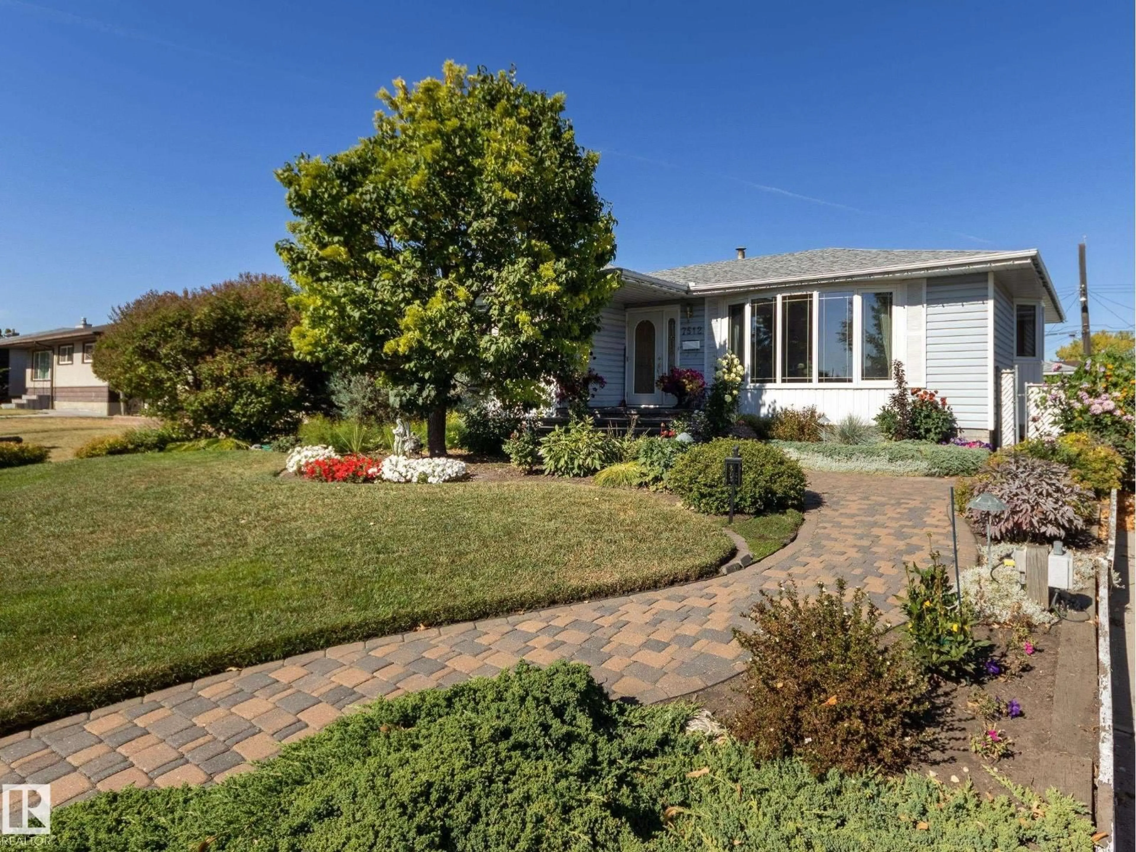A pic from outside/outdoor area/front of a property/back of a property/a pic from drone, street for 7512 129A AV NW, Edmonton Alberta T5C1W9