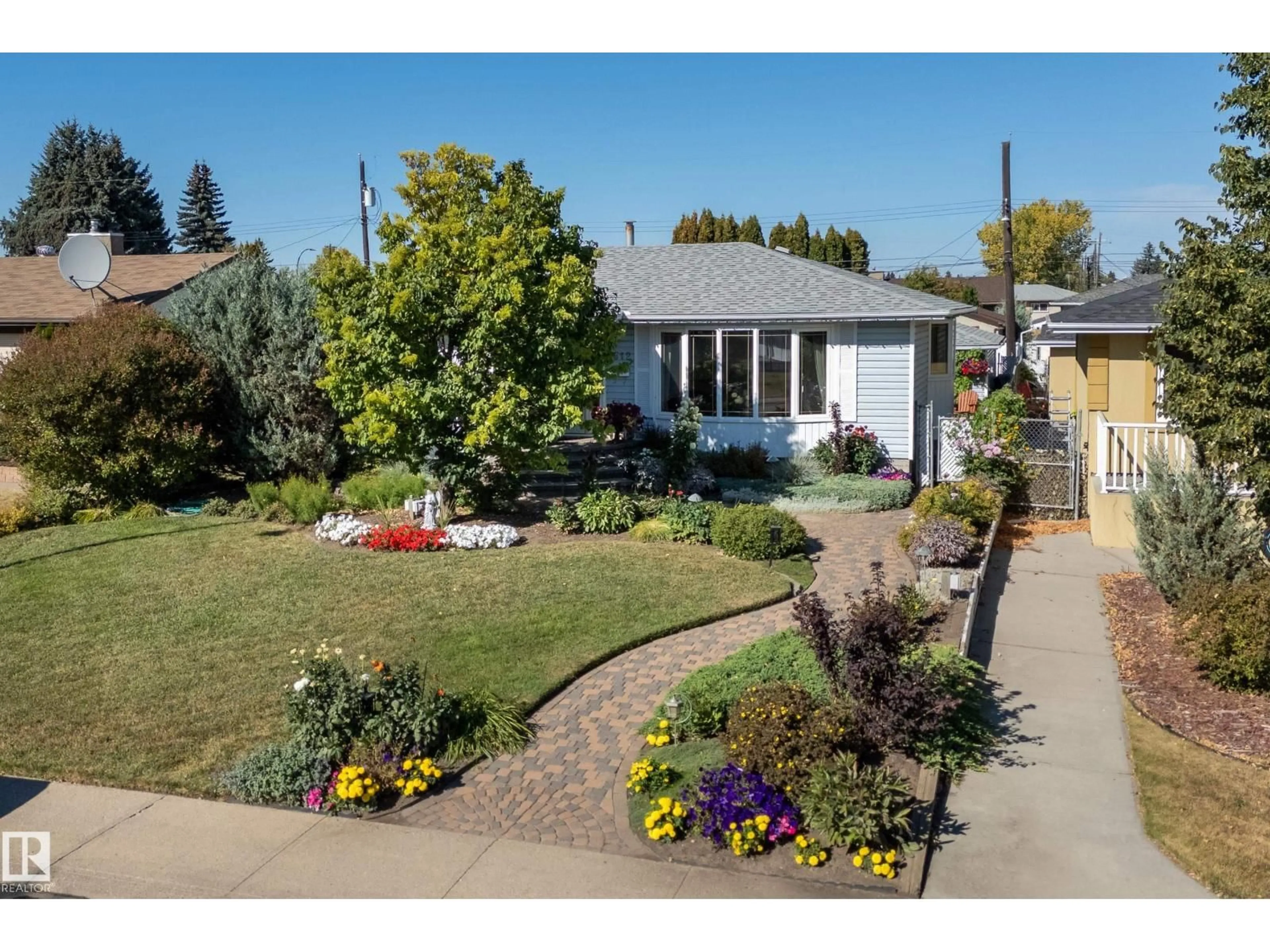 Home with vinyl exterior material, street for 7512 129A AV NW, Edmonton Alberta T5C1W9