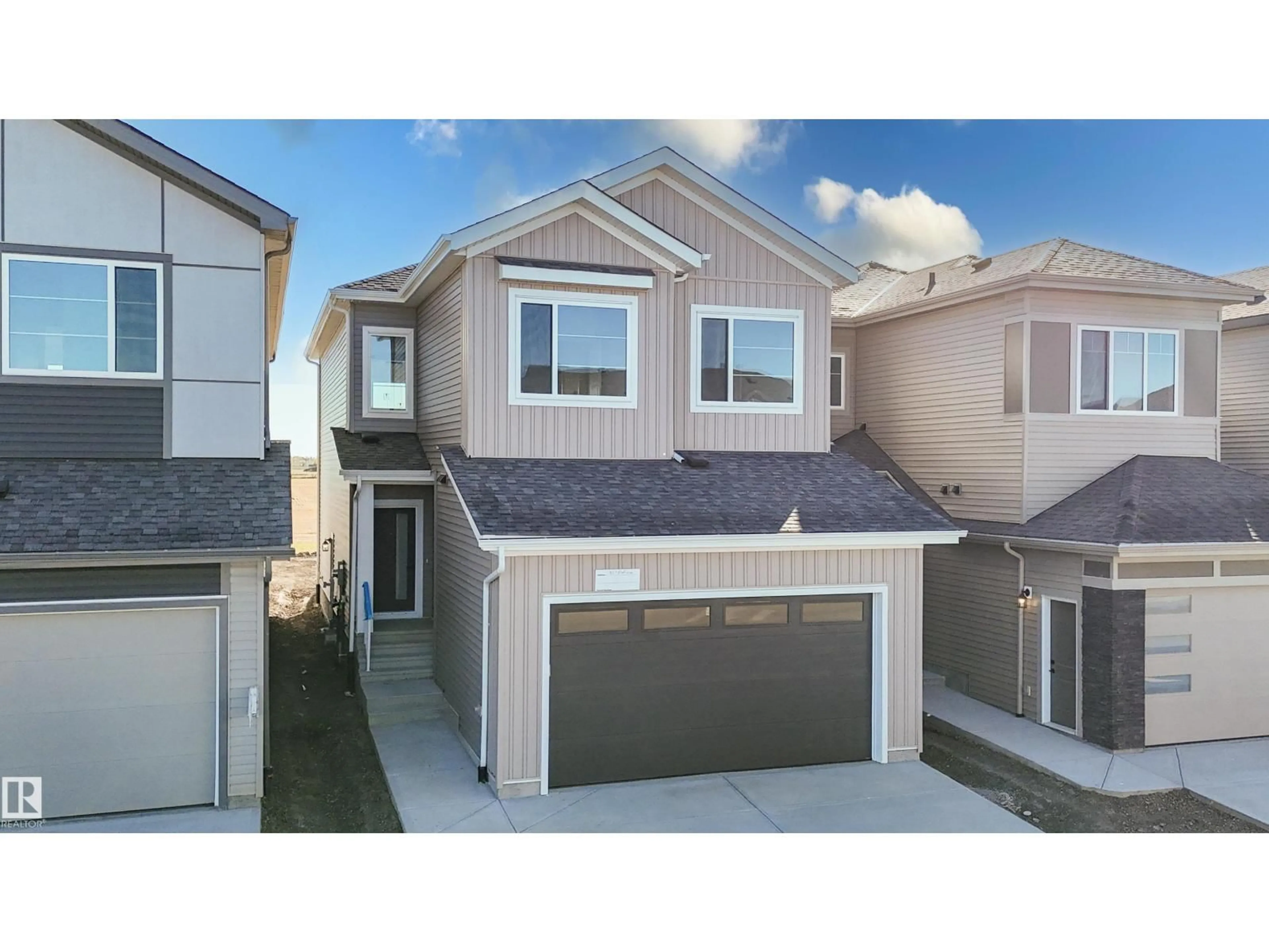 Home with vinyl exterior material, street for 327 BLUFF CV, Leduc Alberta T9E1R5