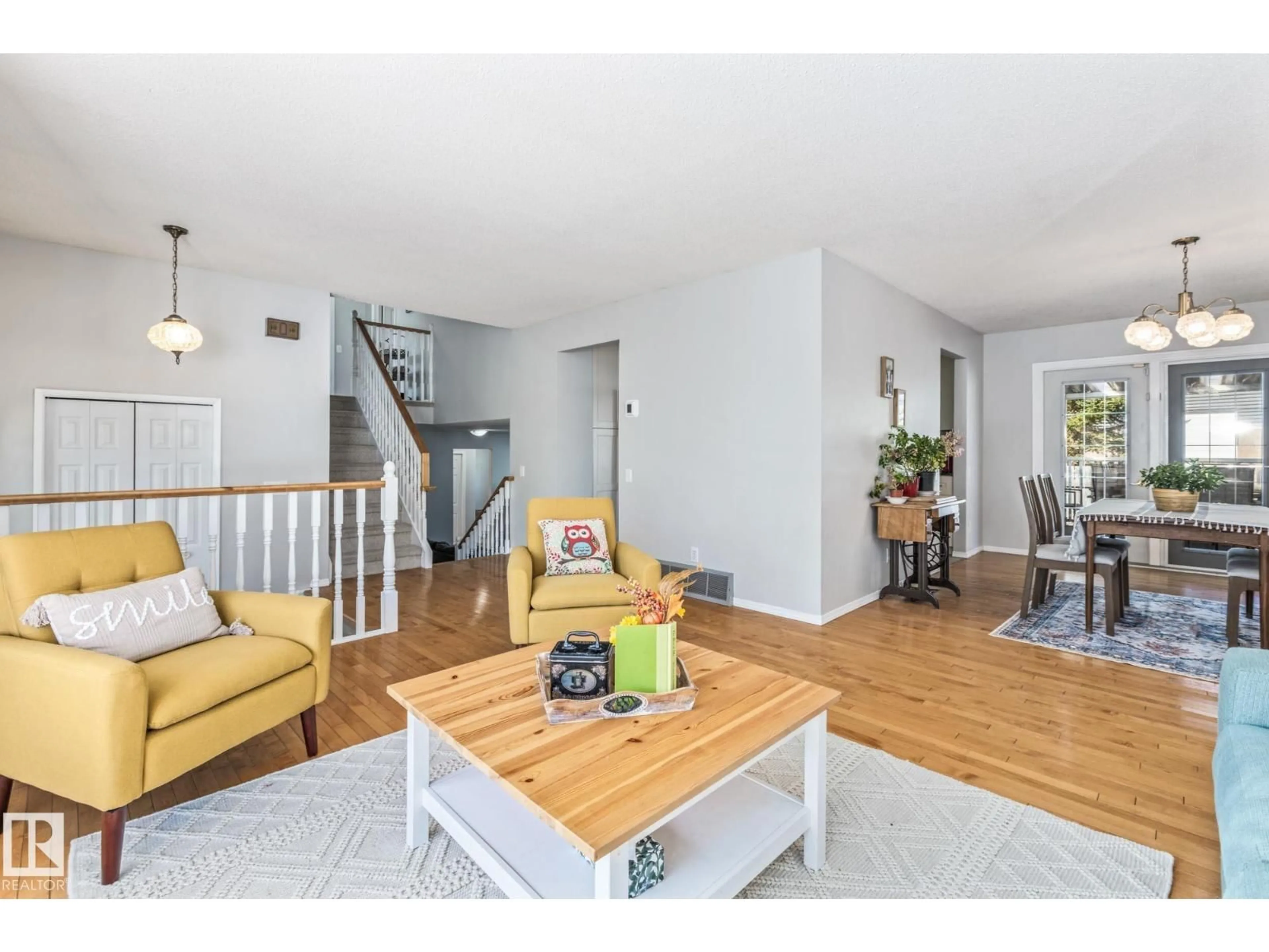 Living room with furniture, wood/laminate floor for 39 ABBEY CR, St. Albert Alberta T8N2X3