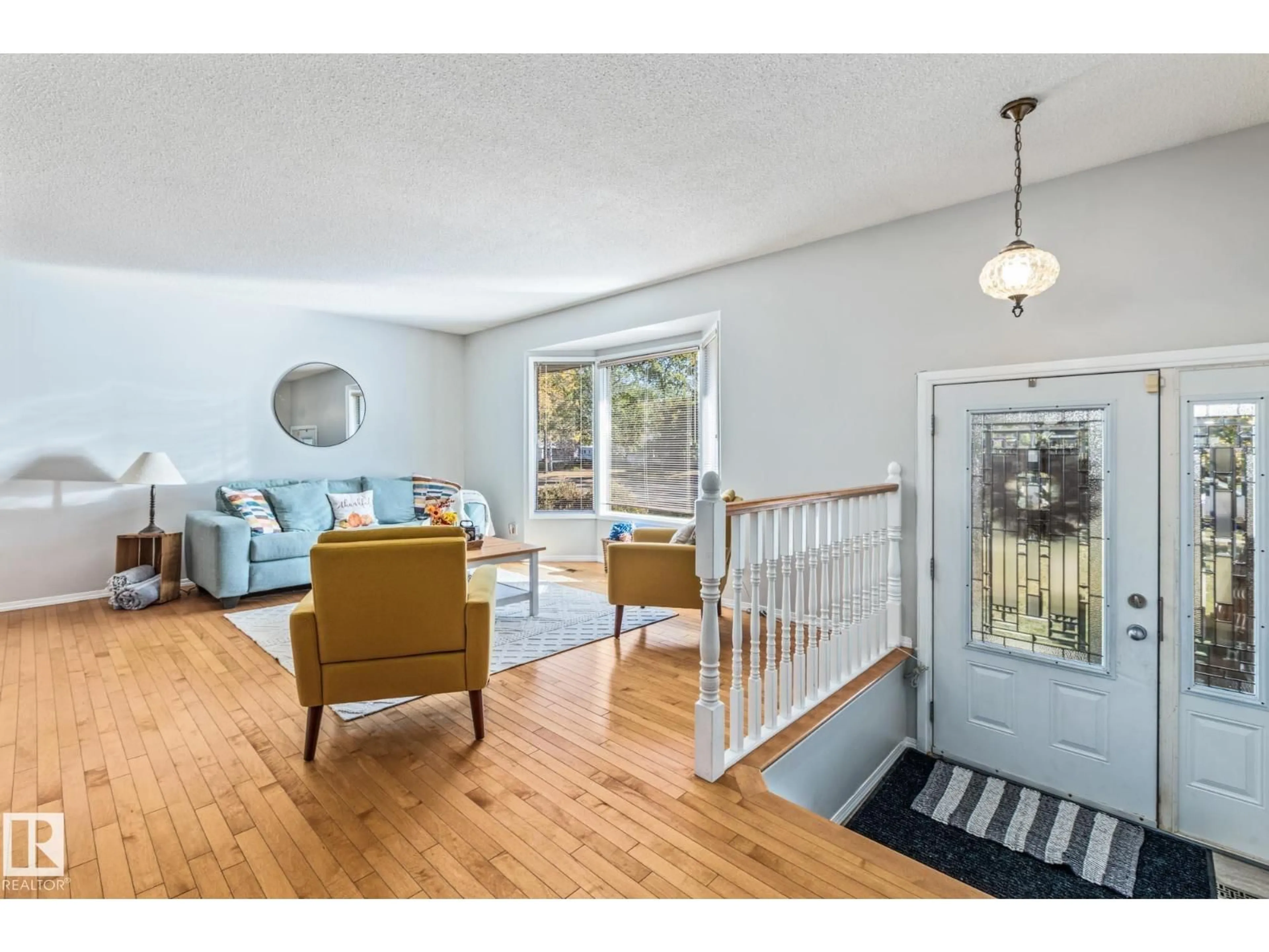 Living room with furniture, wood/laminate floor for 39 ABBEY CR, St. Albert Alberta T8N2X3