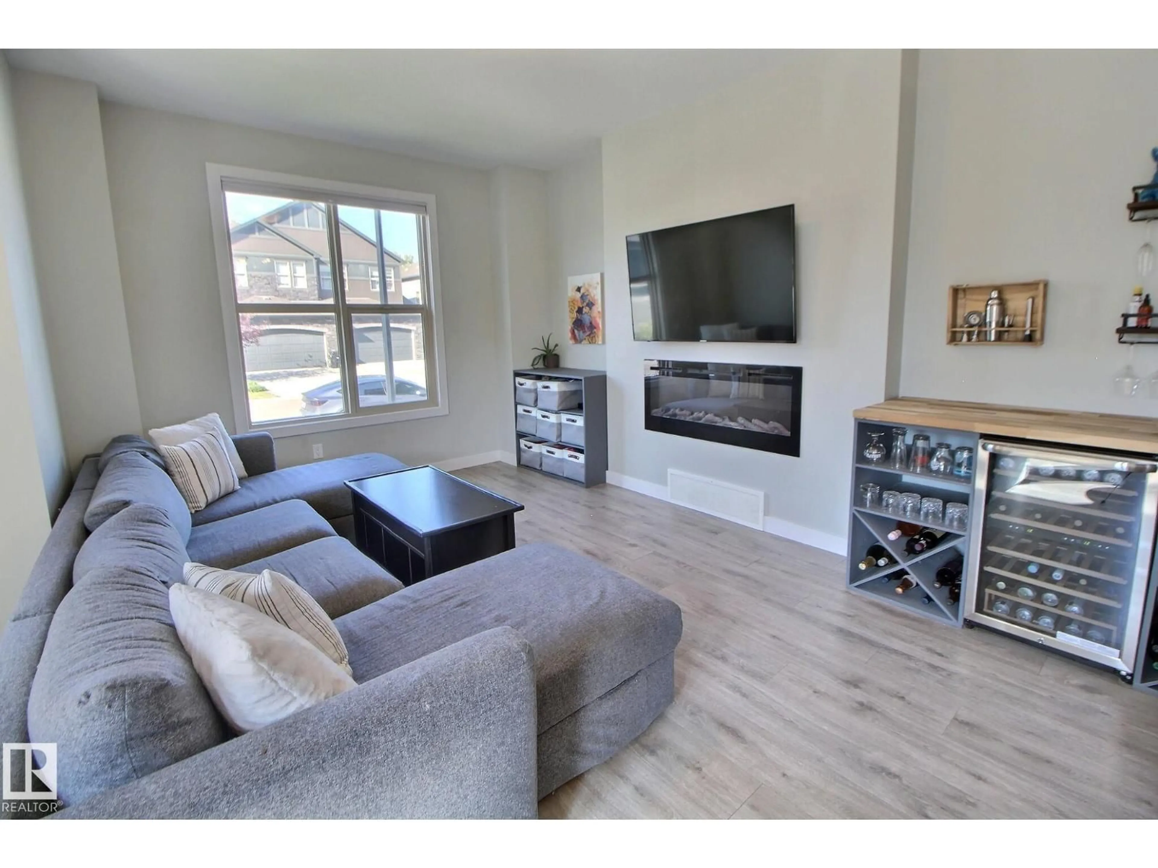 Living room with furniture, wood/laminate floor for 28 GREENBURY MR, Spruce Grove Alberta T7X0M1