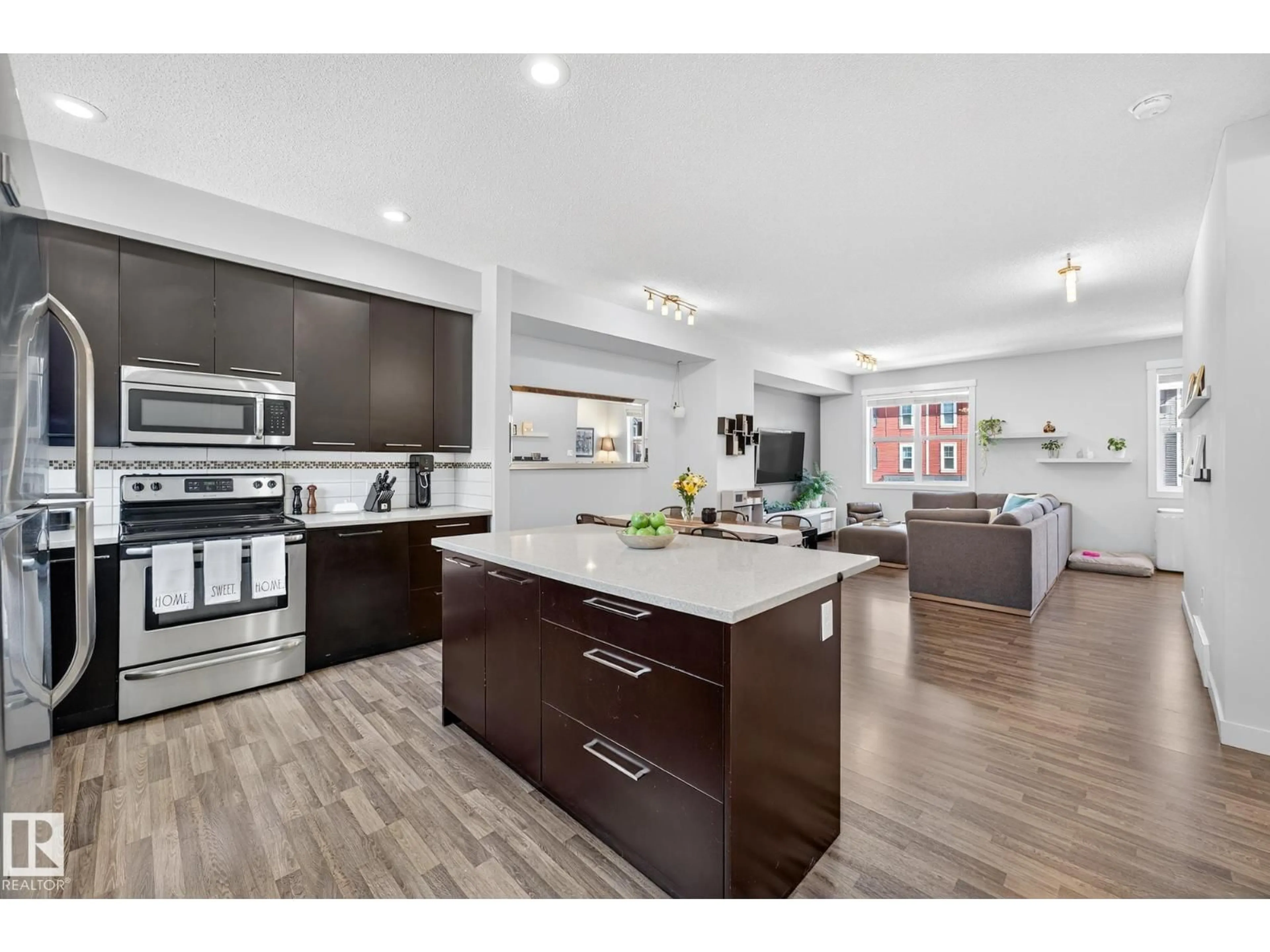 Open concept kitchen, wood/laminate floor for 95 - 8315 180 AV, Edmonton Alberta T5Z0J2