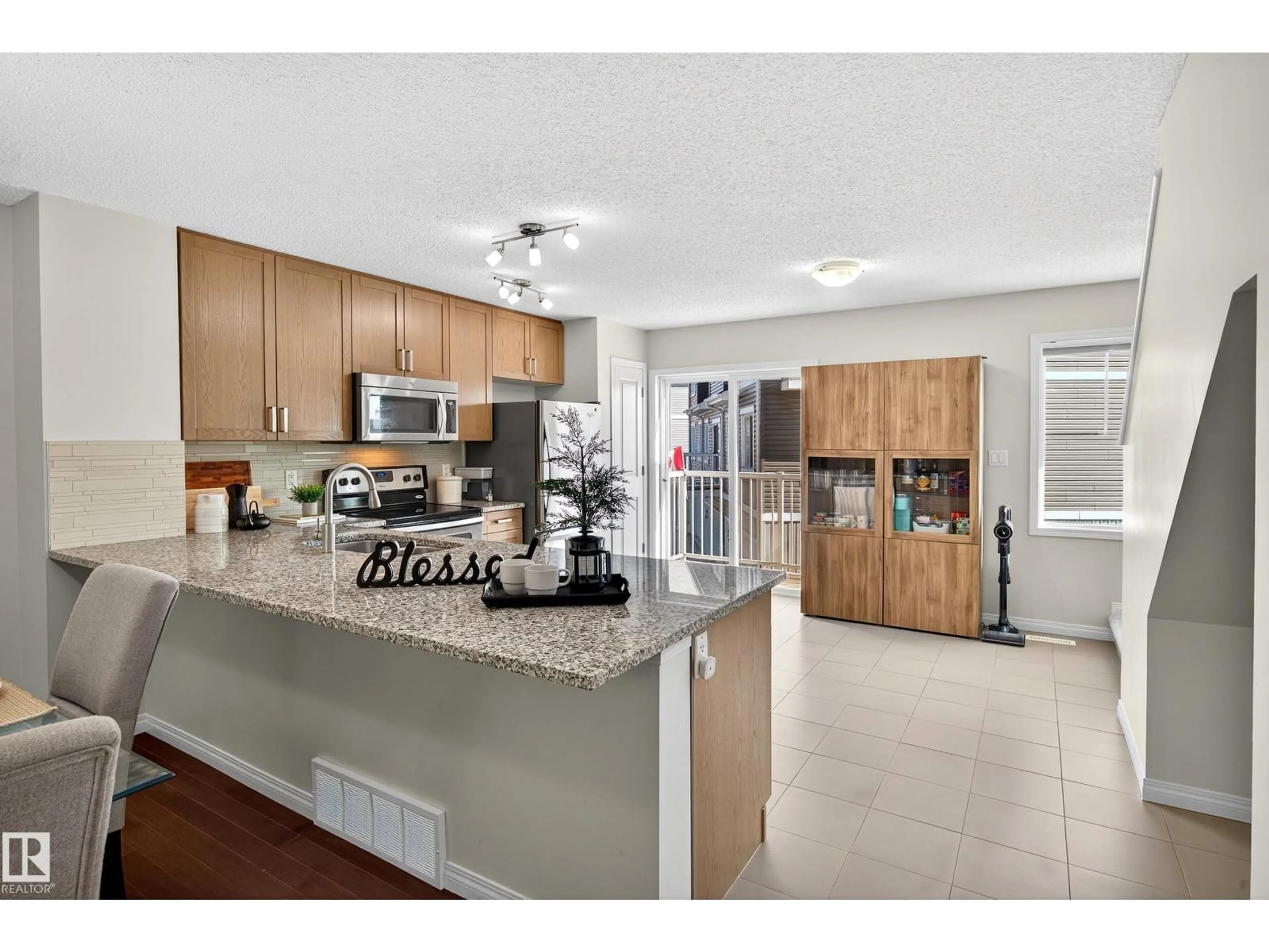 Open concept kitchen, ceramic/tile floor for 1140 - 20 CHAPPELLE BV, Edmonton Alberta T6W2Z3