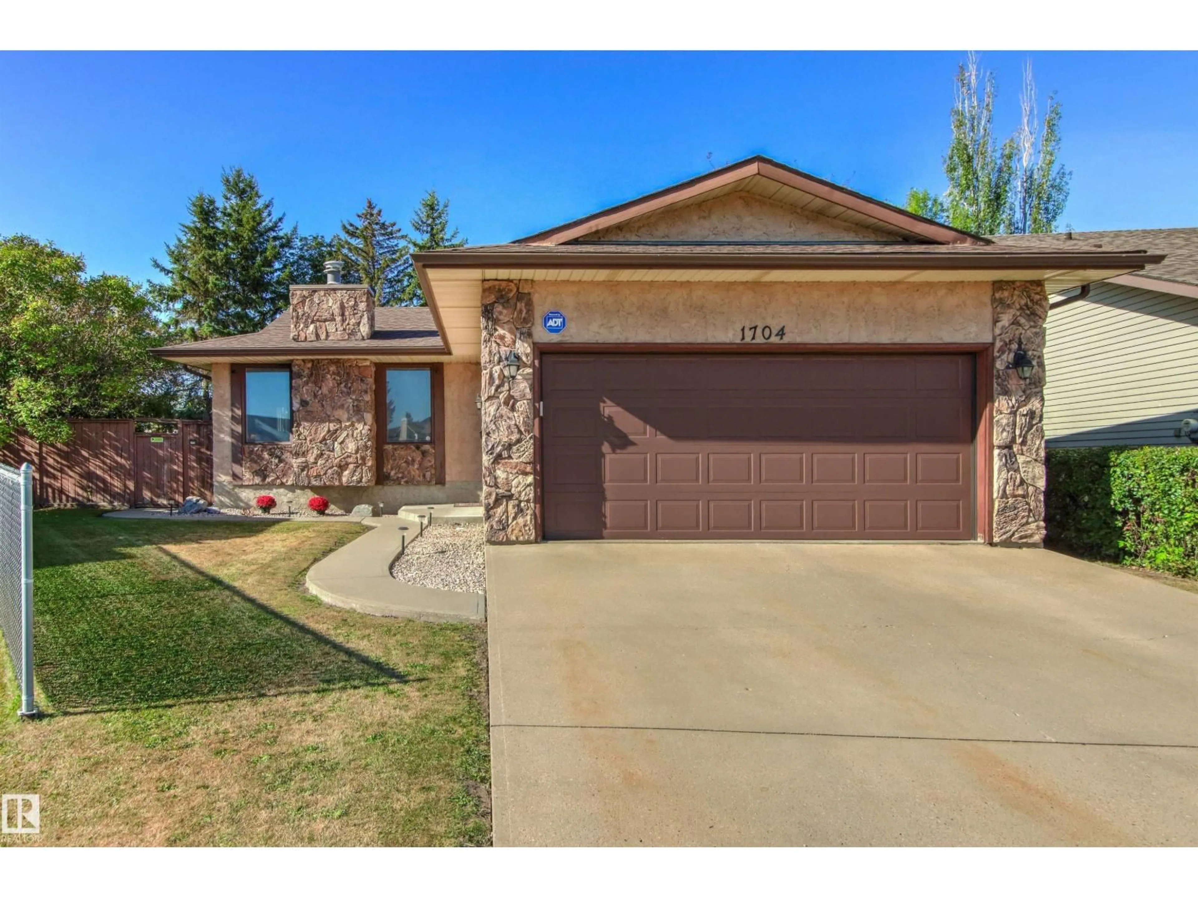 Home with brick exterior material, street for NW - 1704 39 ST, Edmonton Alberta T6L2R5
