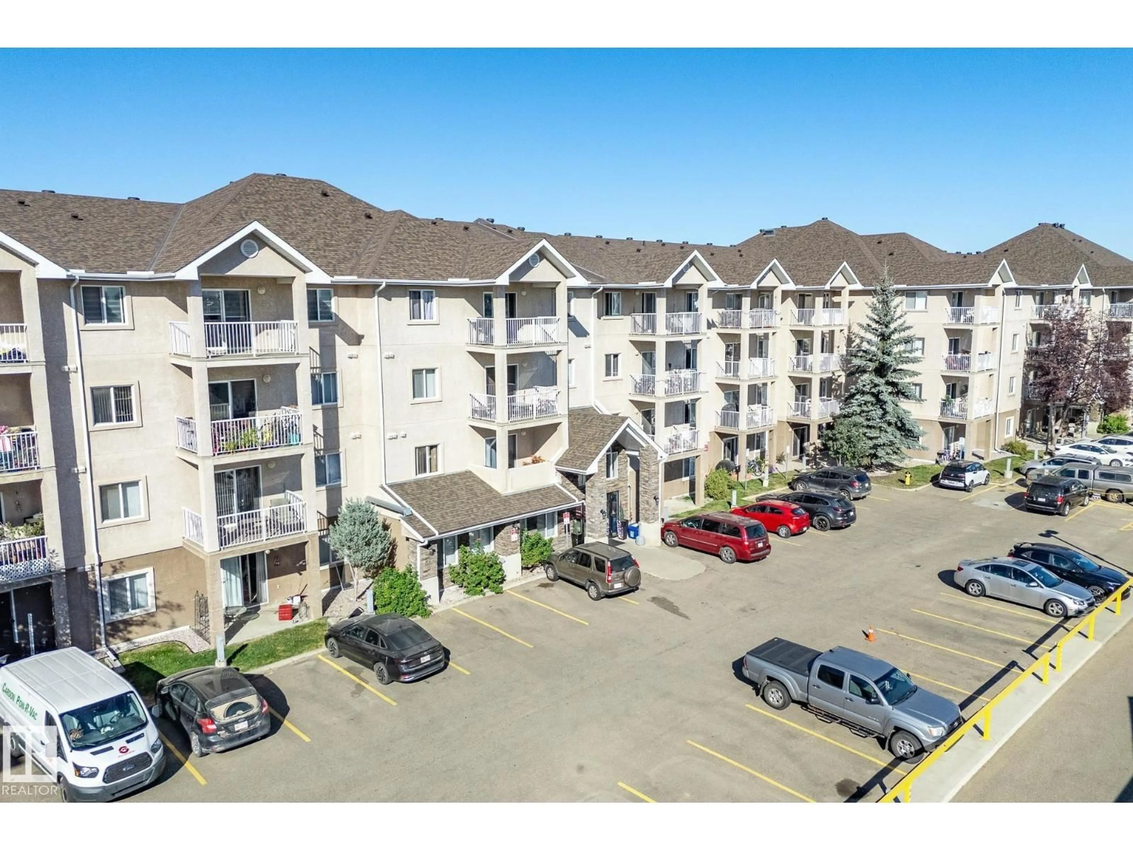 A pic from outside/outdoor area/front of a property/back of a property/a pic from drone, mountain view for #417 - 2305 35A AV, Edmonton Alberta T6T1Z2