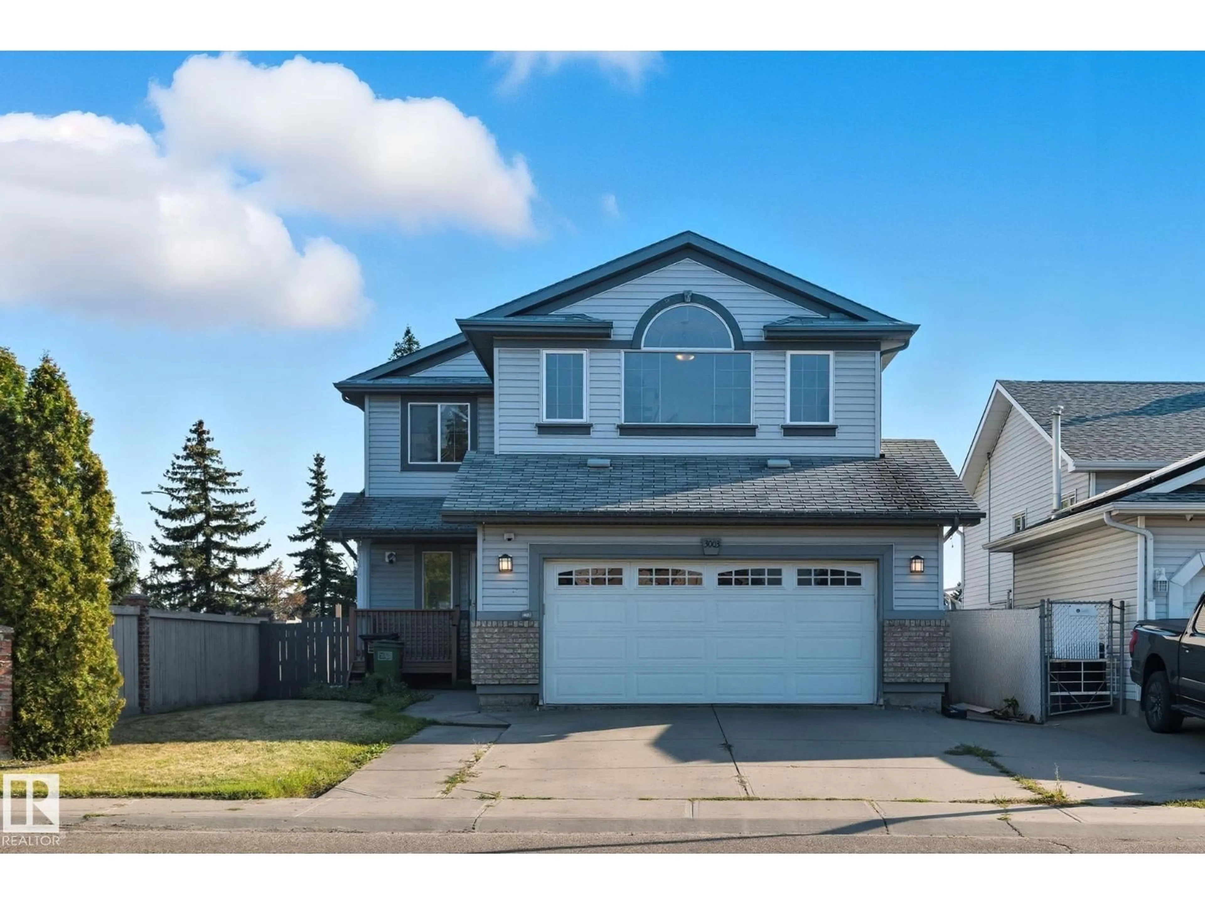 Home with vinyl exterior material, street for 3003 134 AV, Edmonton Alberta T5A5C3