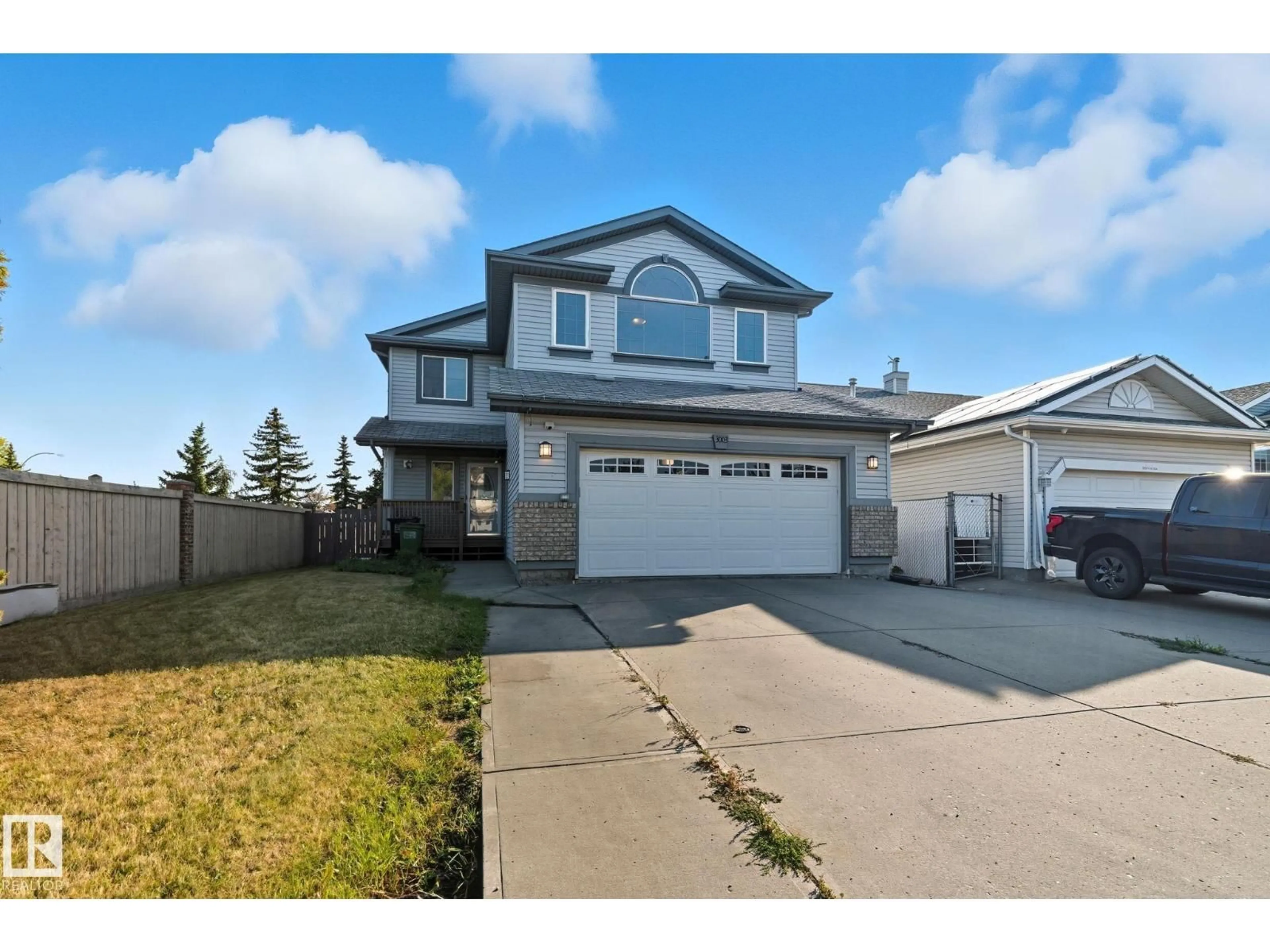 Home with vinyl exterior material, street for 3003 134 AV, Edmonton Alberta T5A5C3