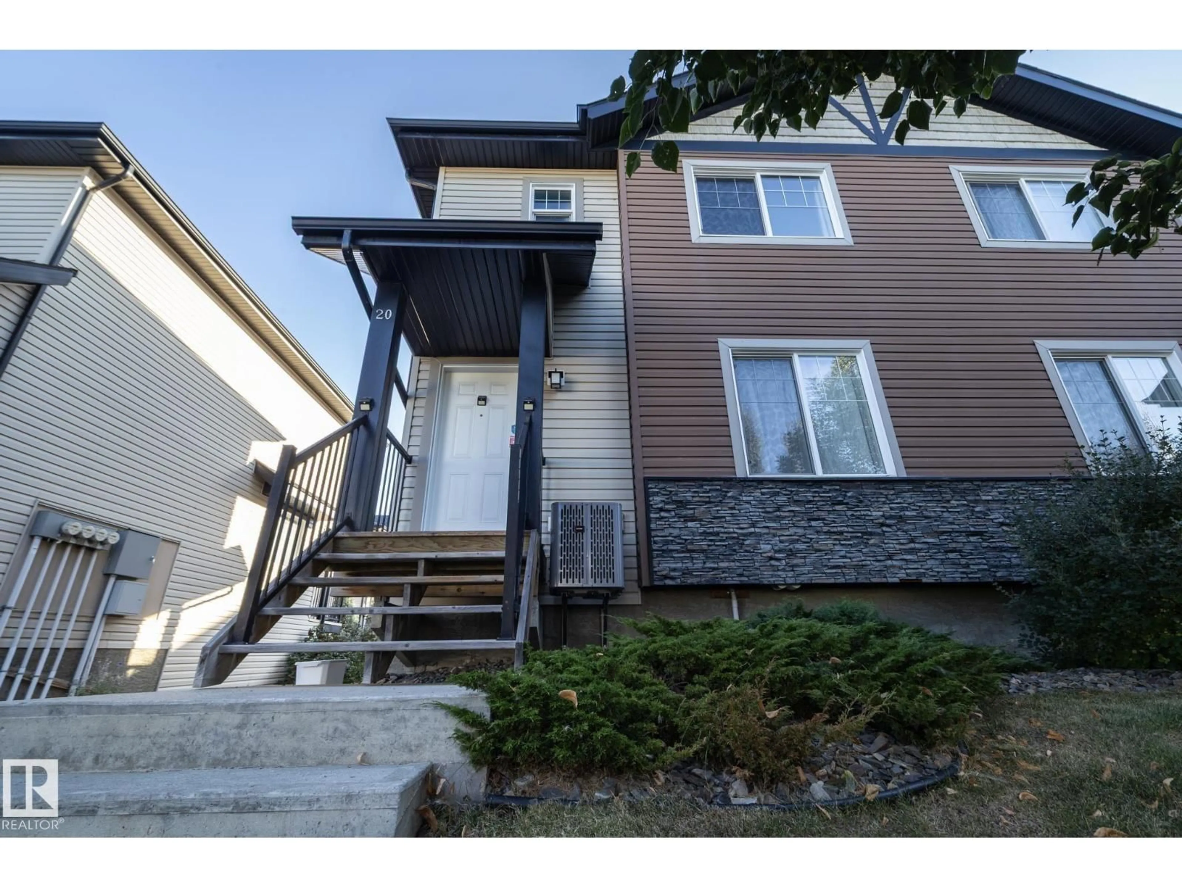 Home with vinyl exterior material, street for #20 - 8716 179 AV, Edmonton Alberta T5Z0B9