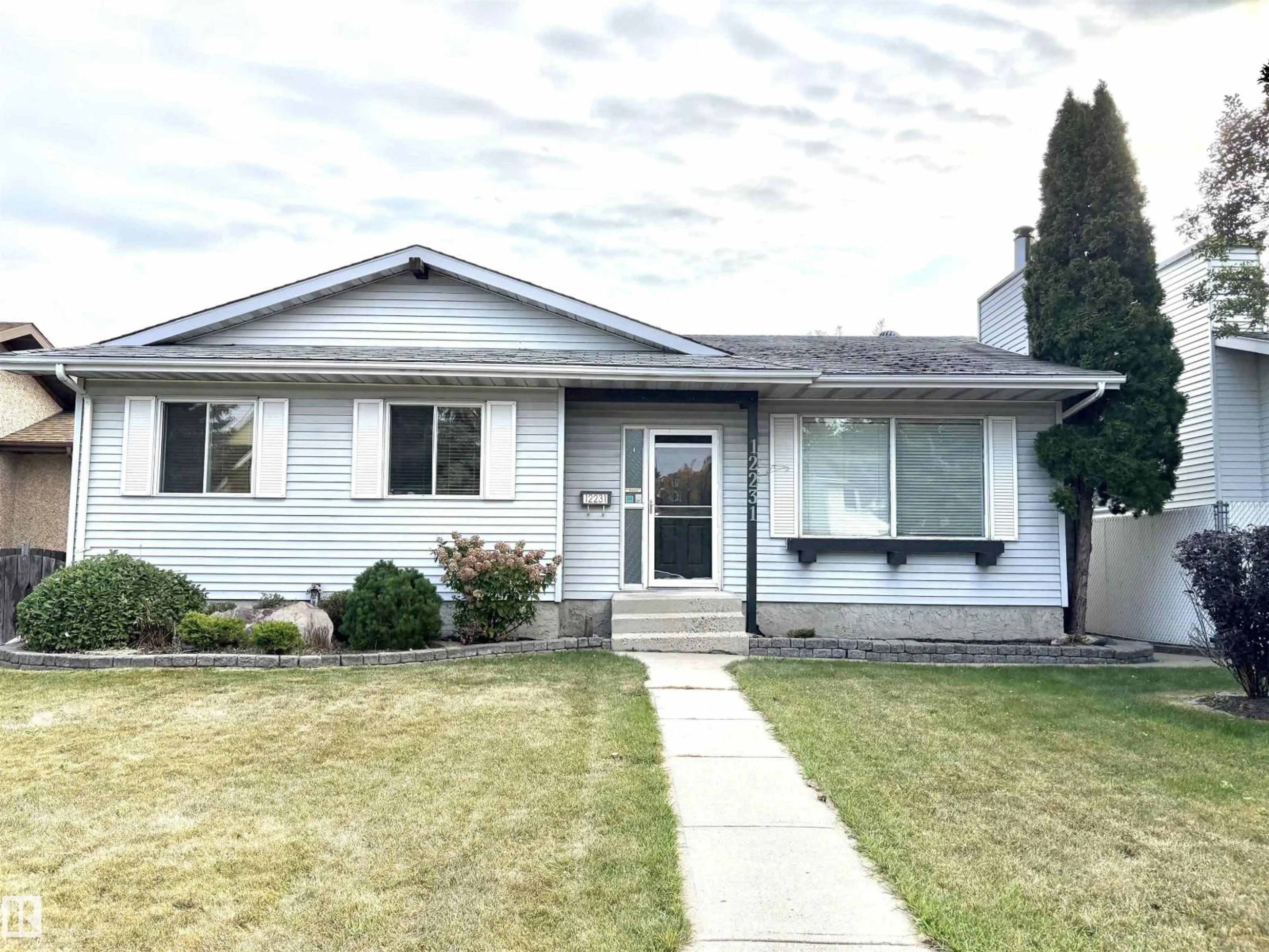 Home with vinyl exterior material, street for NW - 12231 44 ST, Edmonton Alberta T5W4Z5