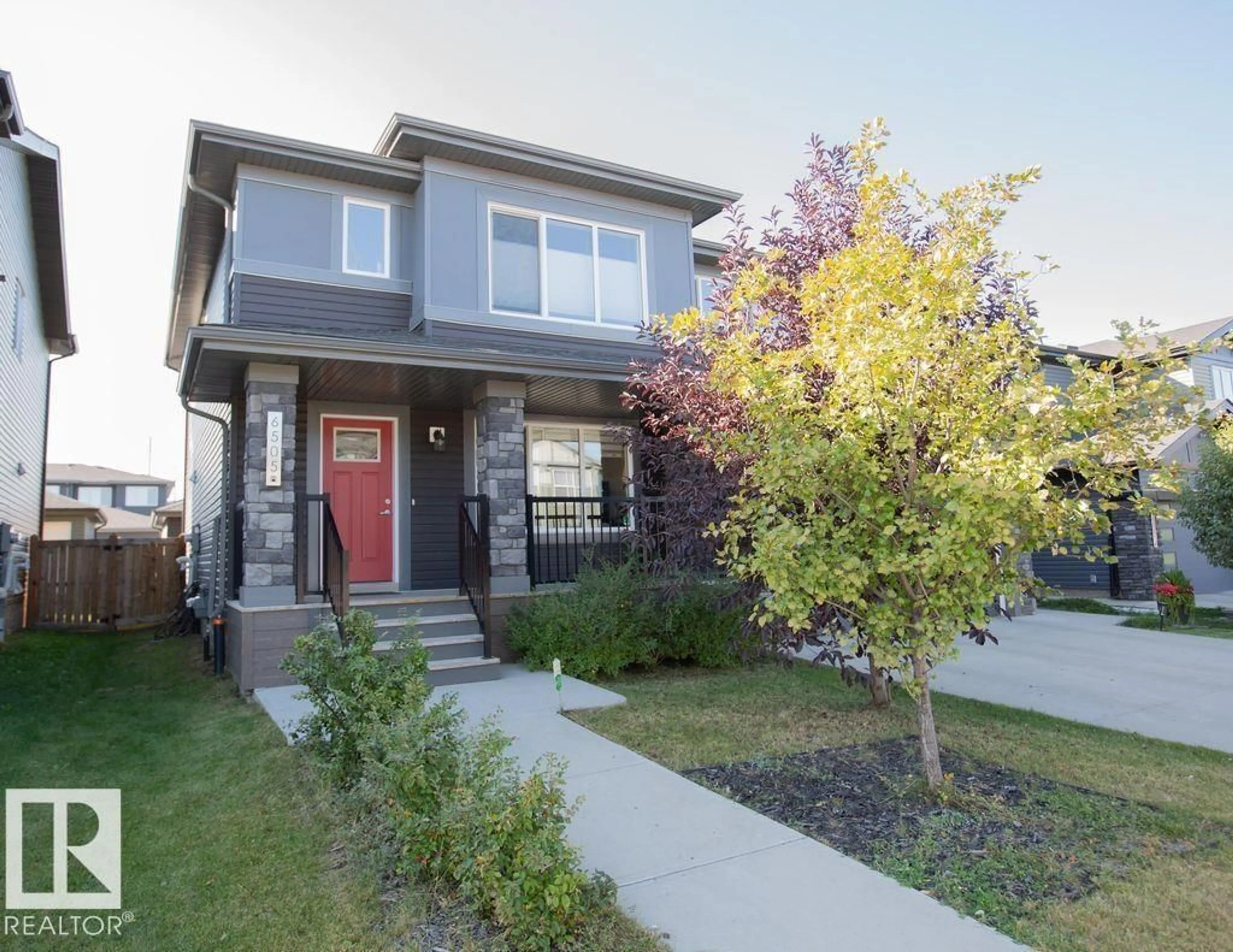 Home with vinyl exterior material, street for 6505 KING WD SW, Edmonton Alberta T6W3Z9