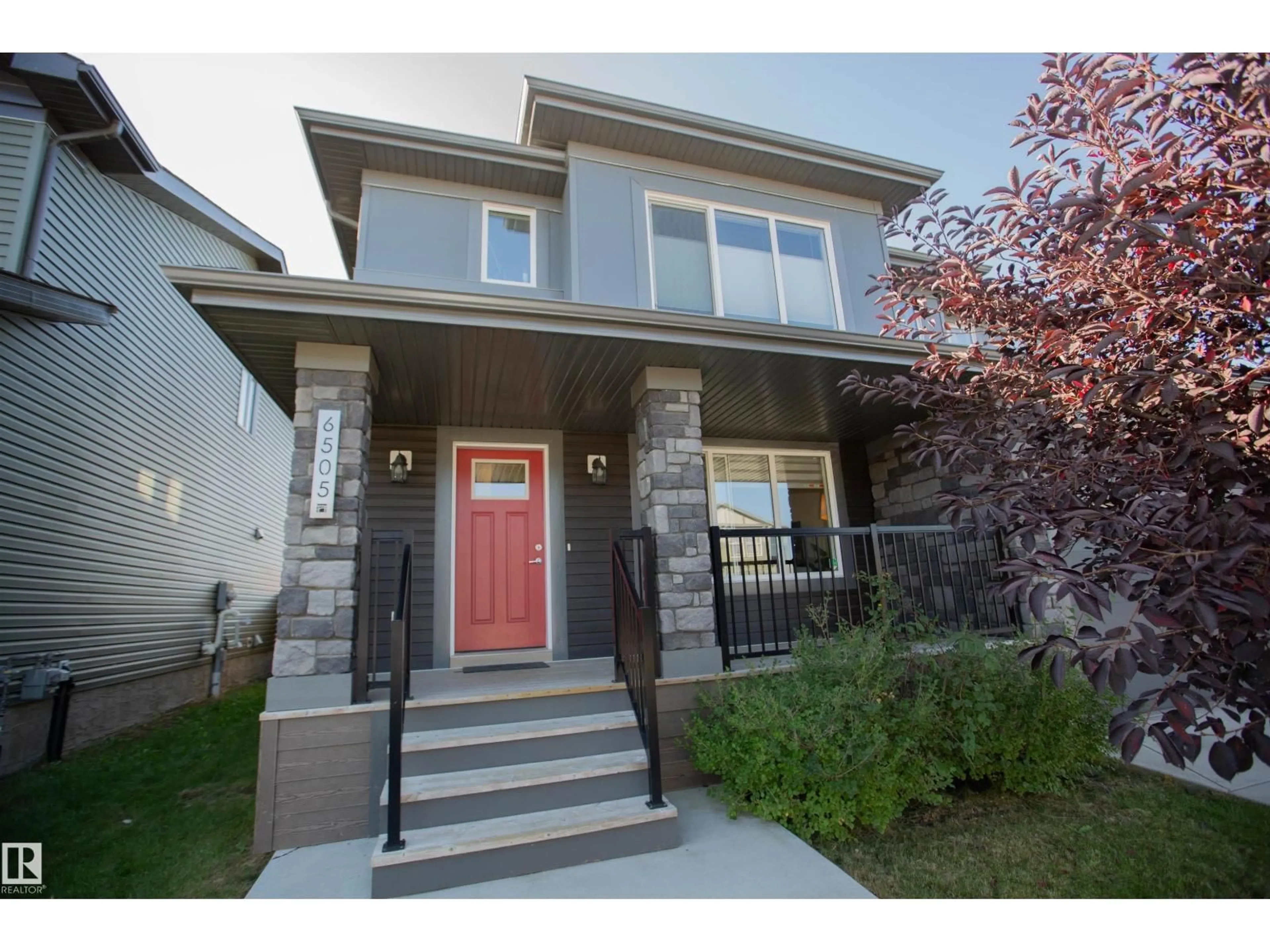 Home with vinyl exterior material, street for 6505 KING WD SW, Edmonton Alberta T6W3Z9