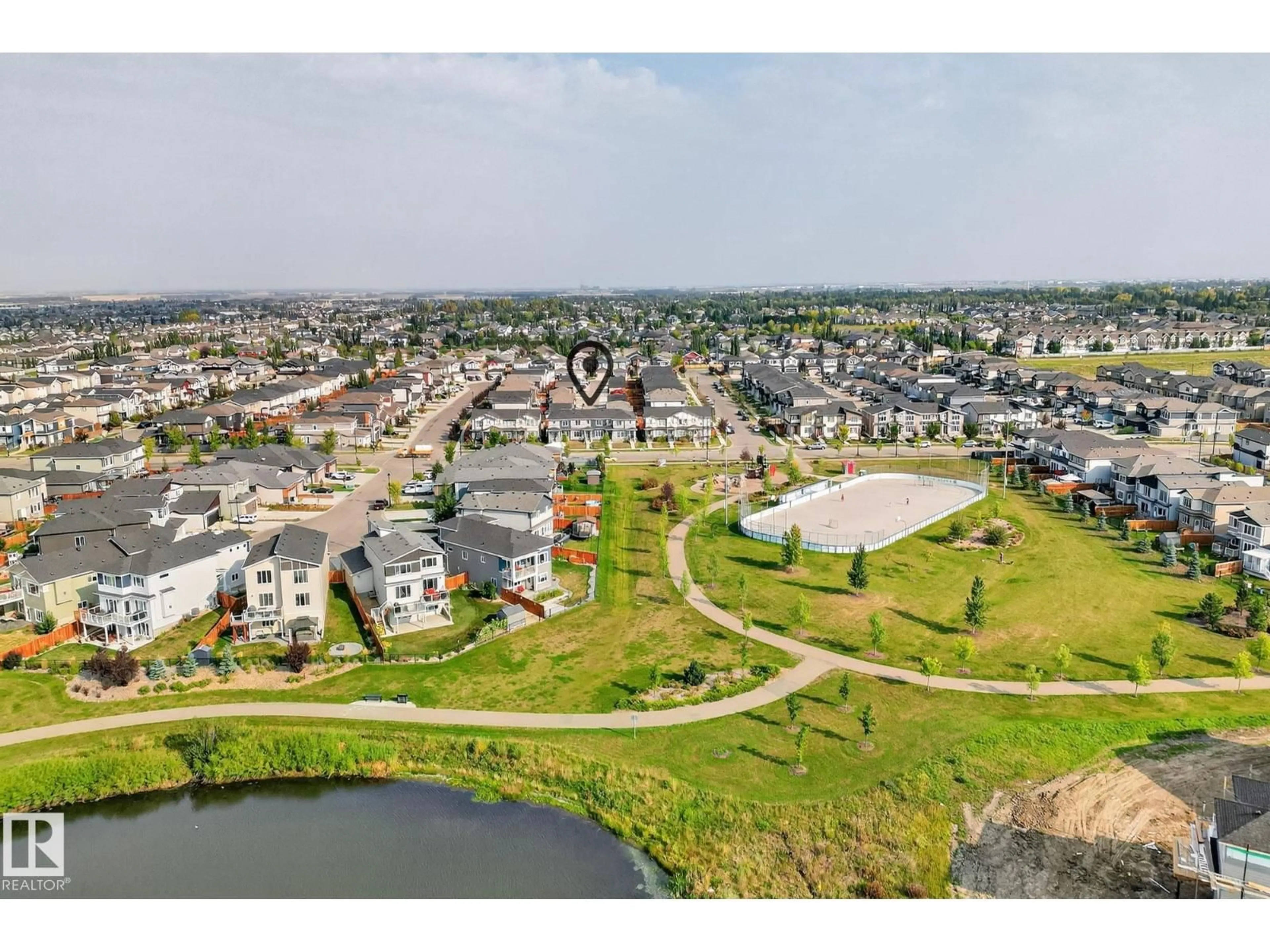A pic from outside/outdoor area/front of a property/back of a property/a pic from drone, water/lake/river/ocean view for 658 BLACK STONE BV, Leduc Alberta T9E1H2