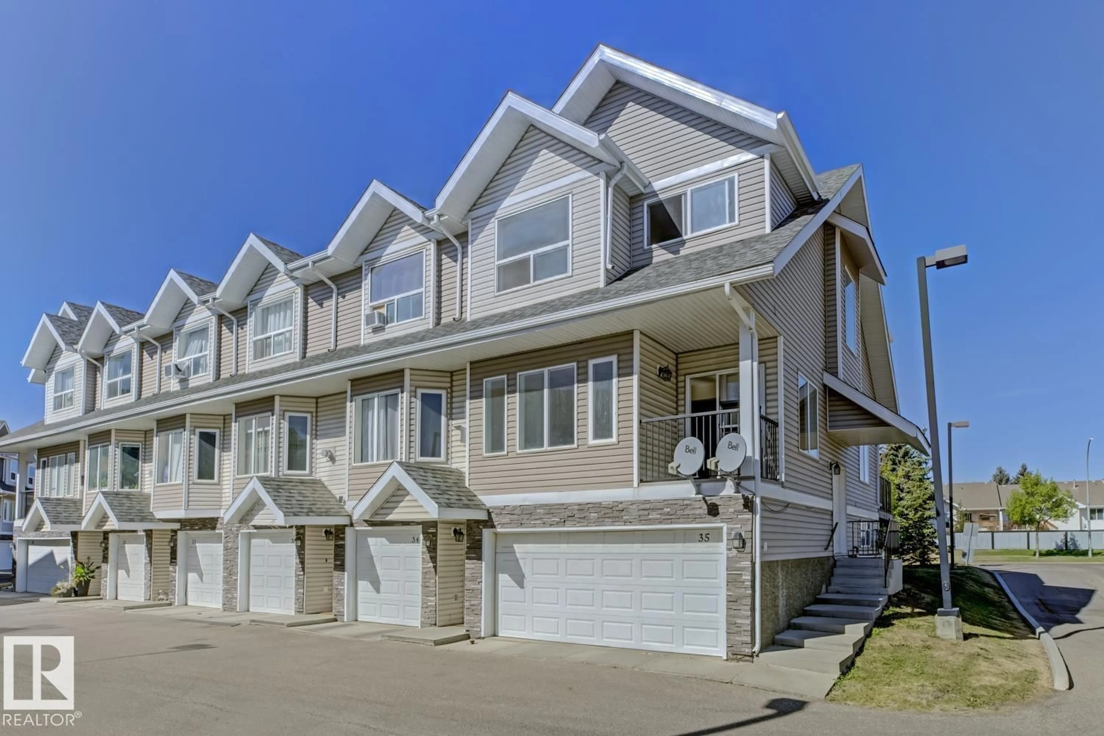 Home with vinyl exterior material, street for #35 - 13215 153 AV, Edmonton Alberta T6X1J7
