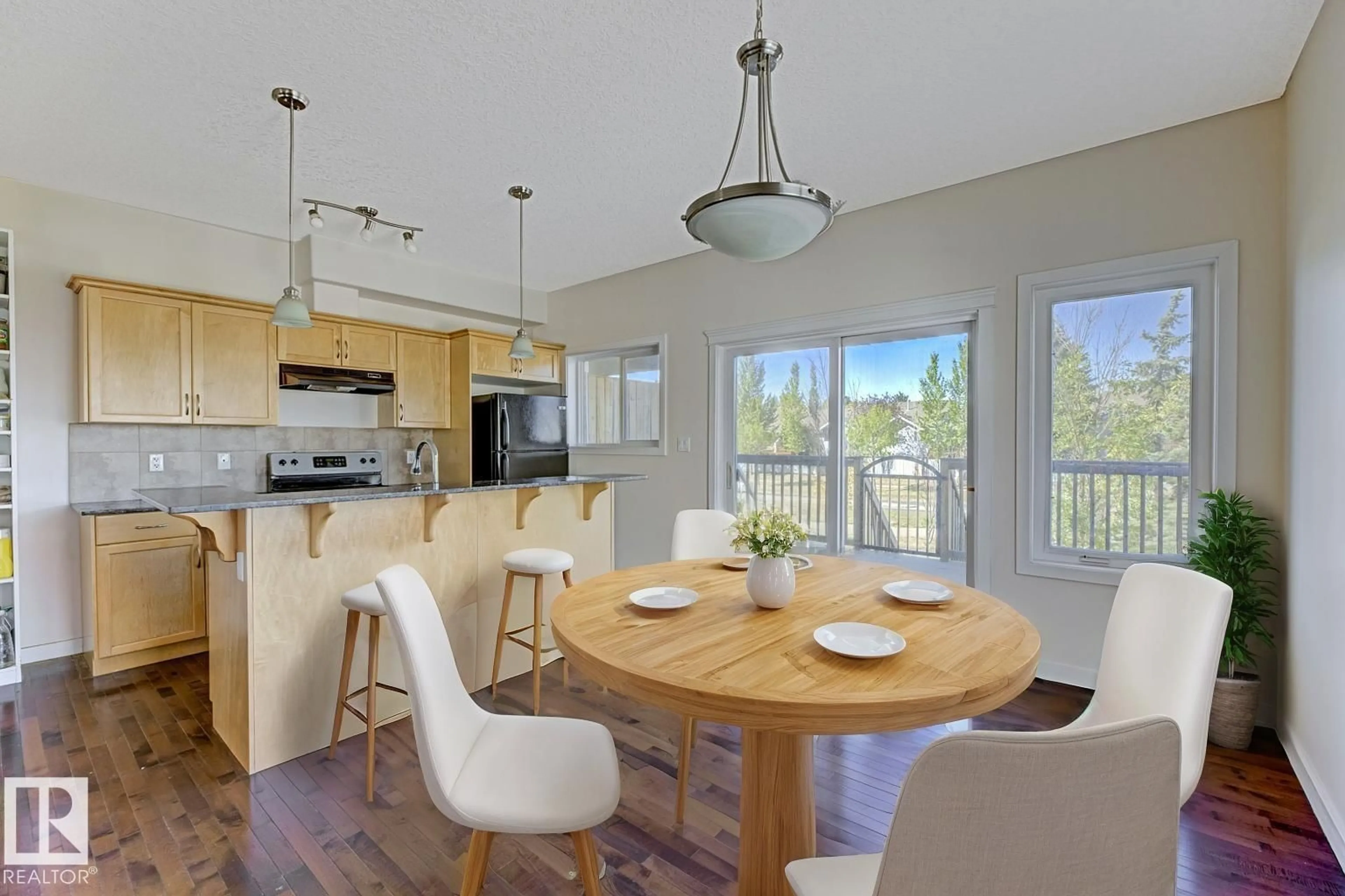 Open concept kitchen, wood/laminate floor for #35 - 13215 153 AV, Edmonton Alberta T6X1J7