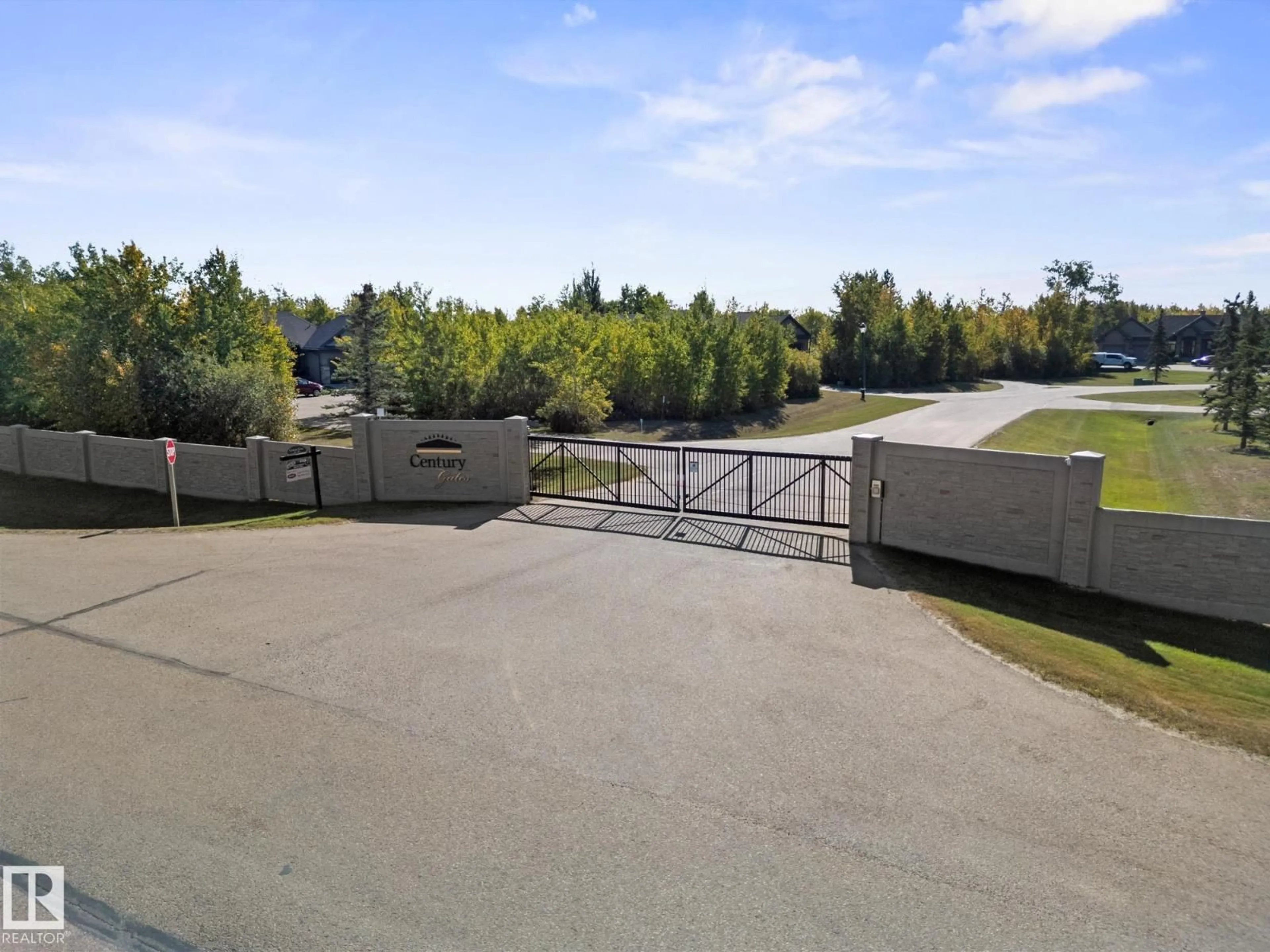 A pic from outside/outdoor area/front of a property/back of a property/a pic from drone, unknown for 9B - 53522 RGE ROAD 272, Rural Parkland County Alberta T7X3M5