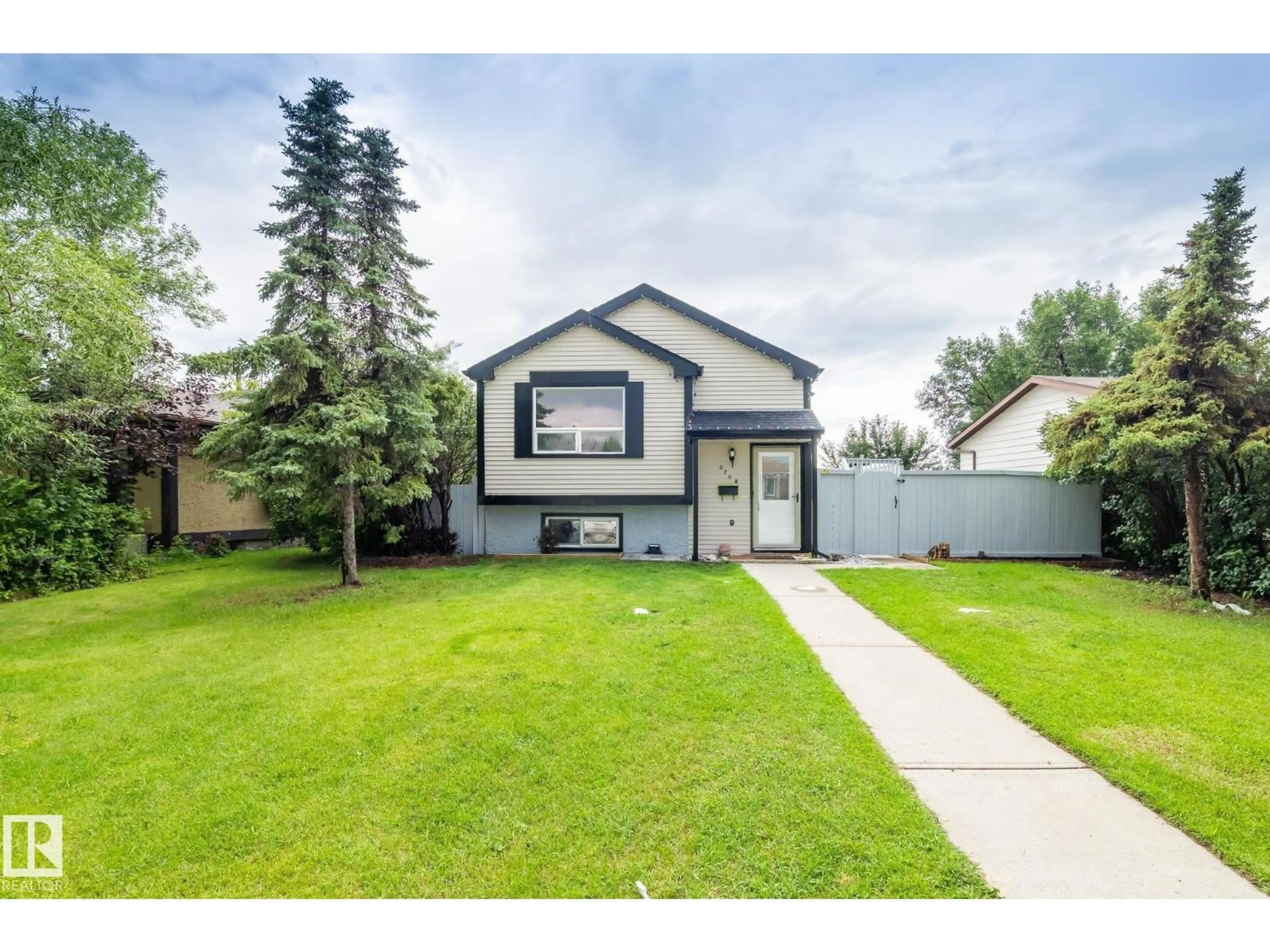 Home with vinyl exterior material, street for 3708 12 AV, Edmonton Alberta T6L3B2