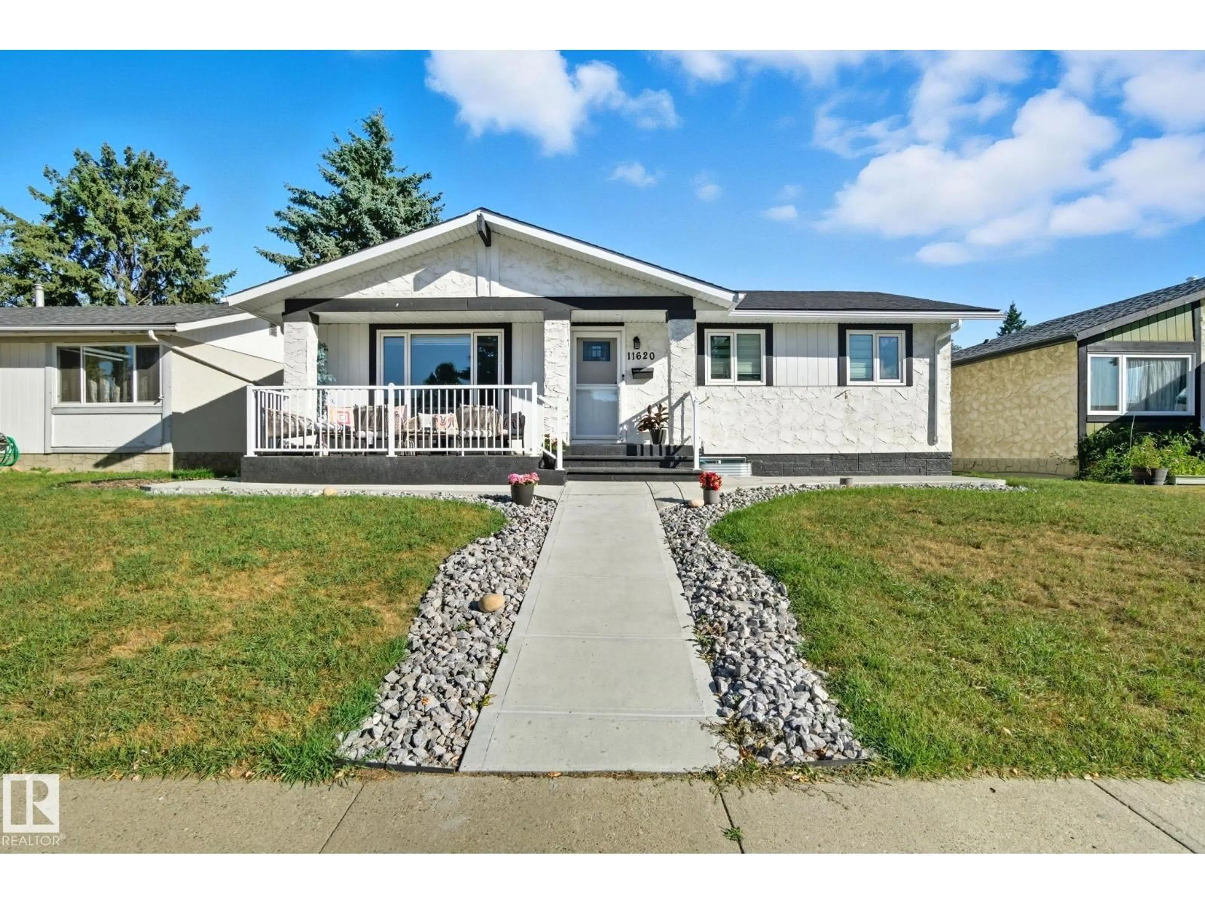 Home with vinyl exterior material, street for 11620 151 AV, Edmonton Alberta T5X1C6