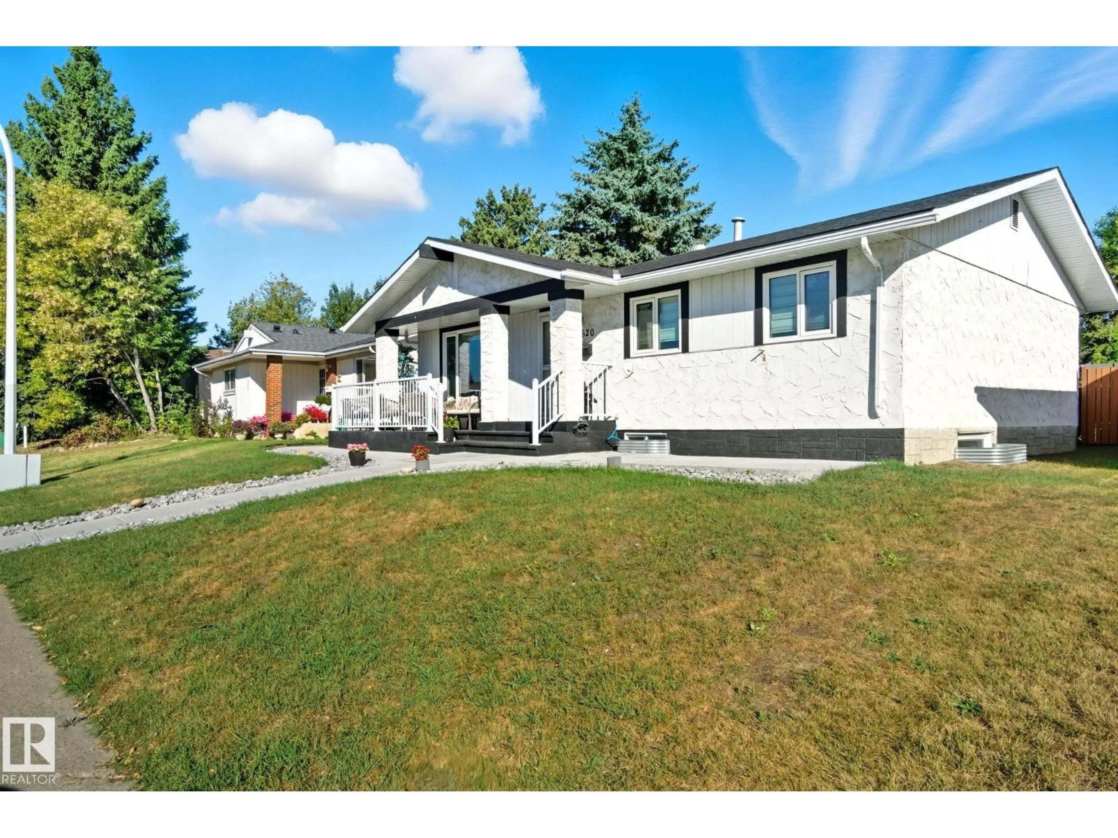 Home with vinyl exterior material, street for 11620 151 AV, Edmonton Alberta T5X1C6