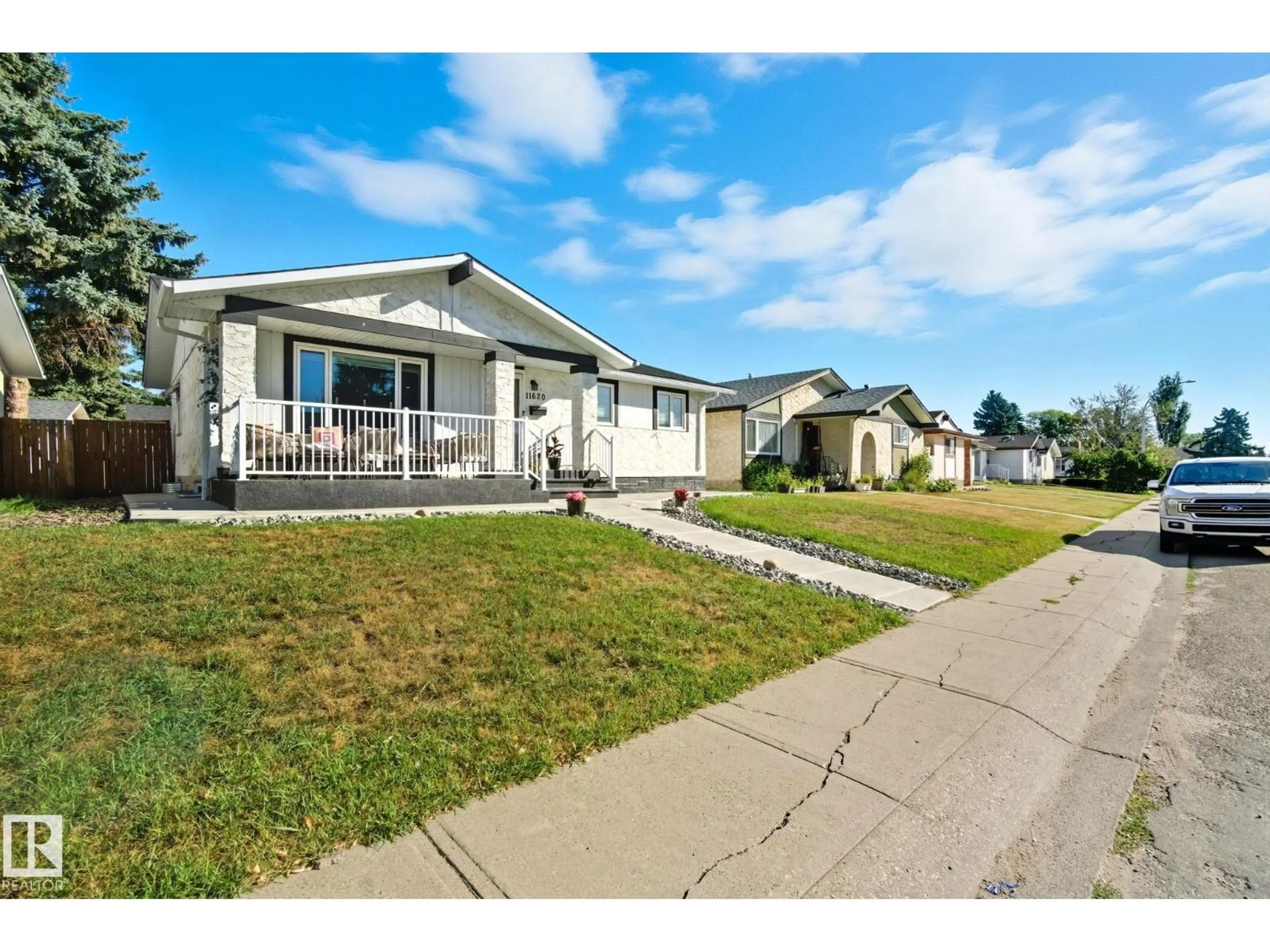 Home with vinyl exterior material, street for 11620 151 AV, Edmonton Alberta T5X1C6