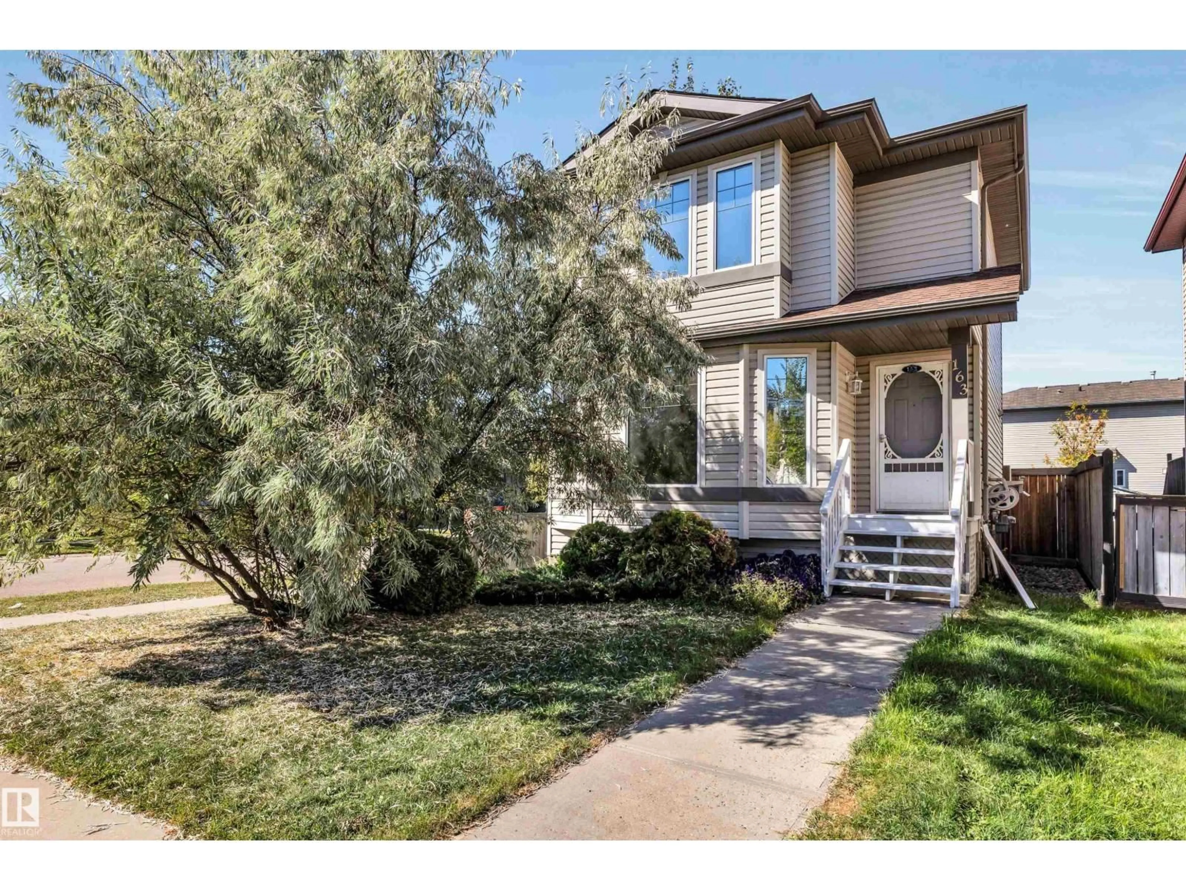 Home with vinyl exterior material, street for 163 BRIDGEPORT BV, Leduc Alberta T9E0H8
