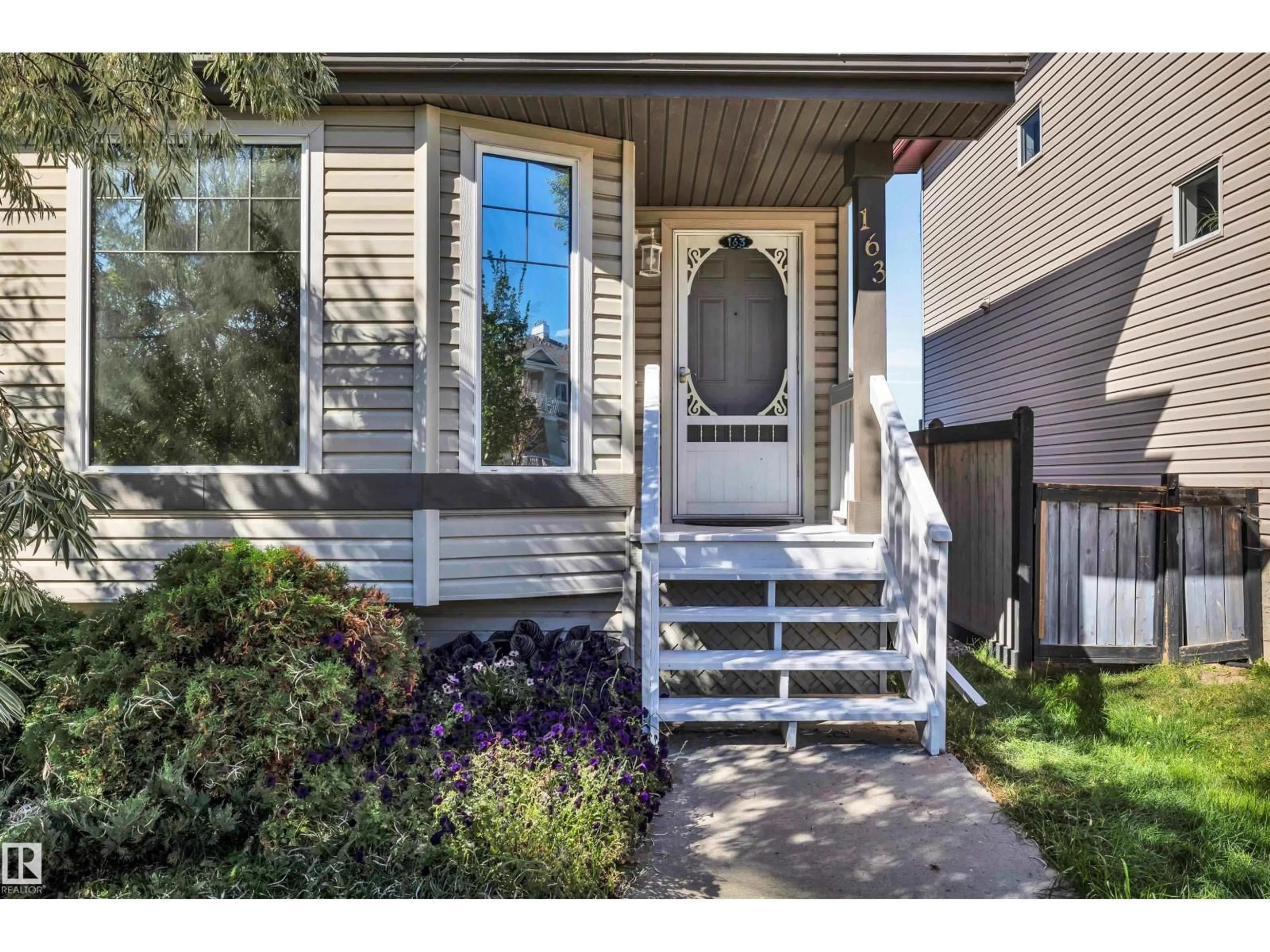 Home with vinyl exterior material, street for 163 BRIDGEPORT BV, Leduc Alberta T9E0H8