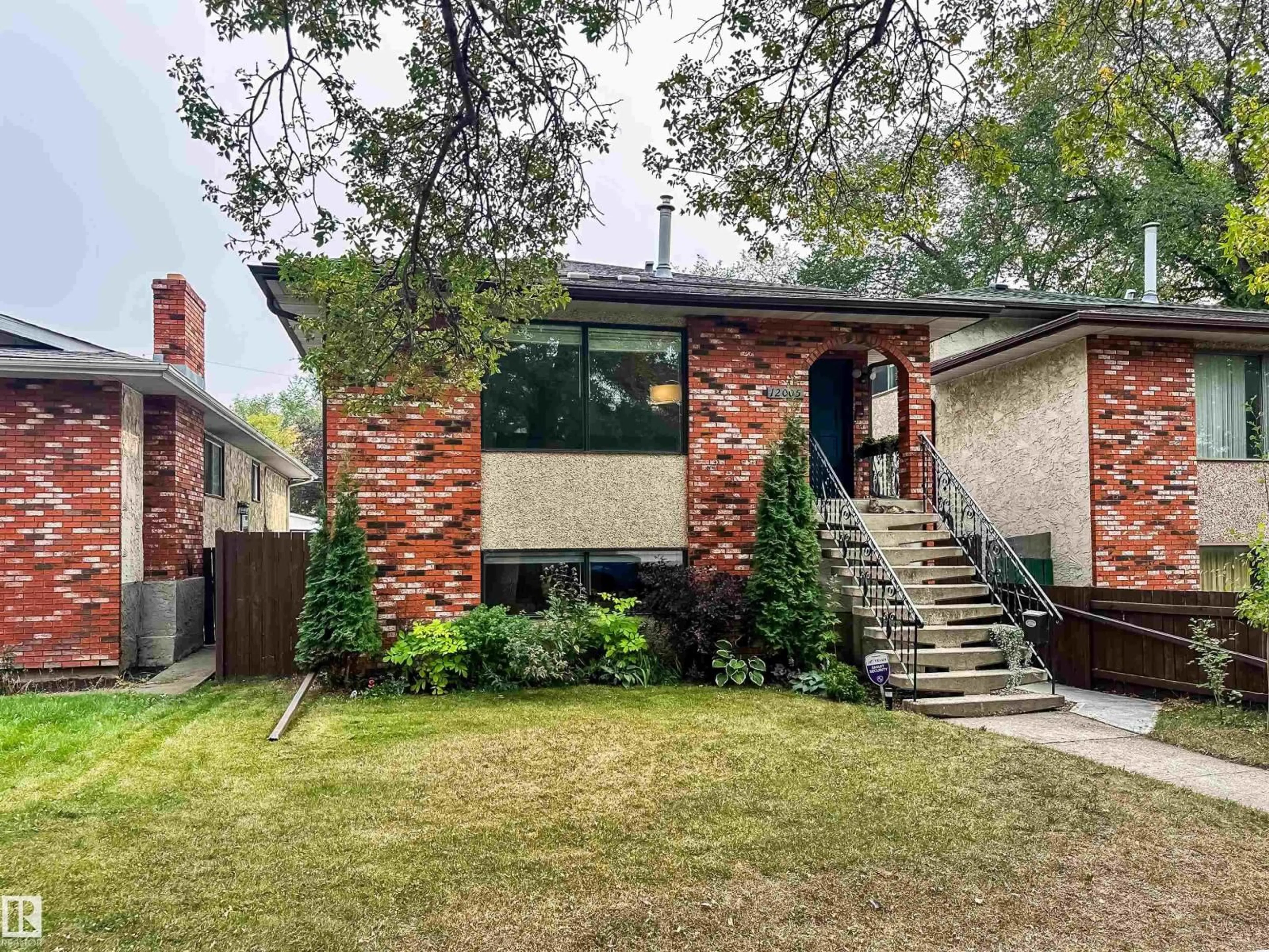 Home with brick exterior material, street for 12005 90 ST, Edmonton Alberta T5B3Z2