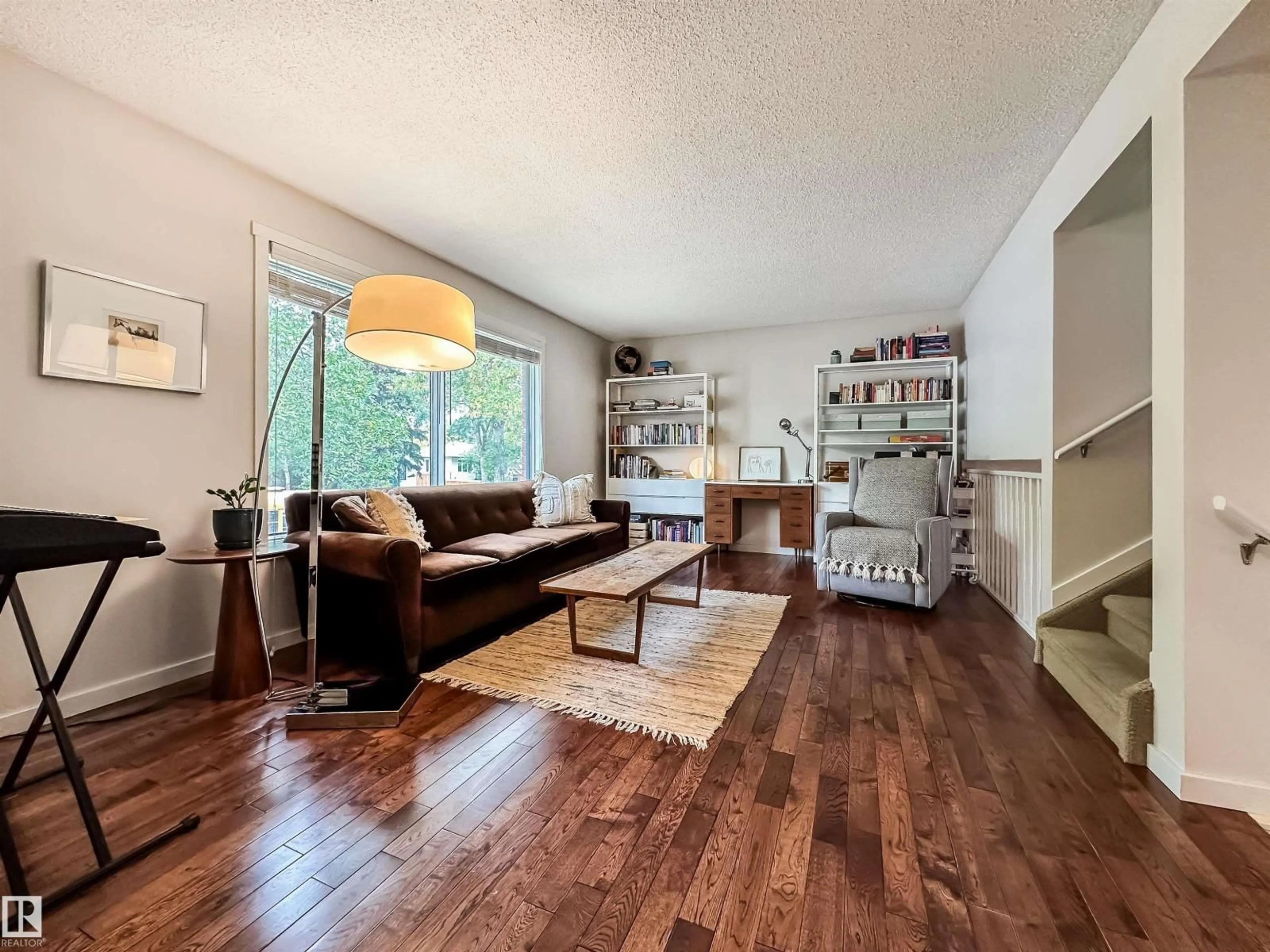 Living room with furniture, wood/laminate floor for 12005 90 ST, Edmonton Alberta T5B3Z2
