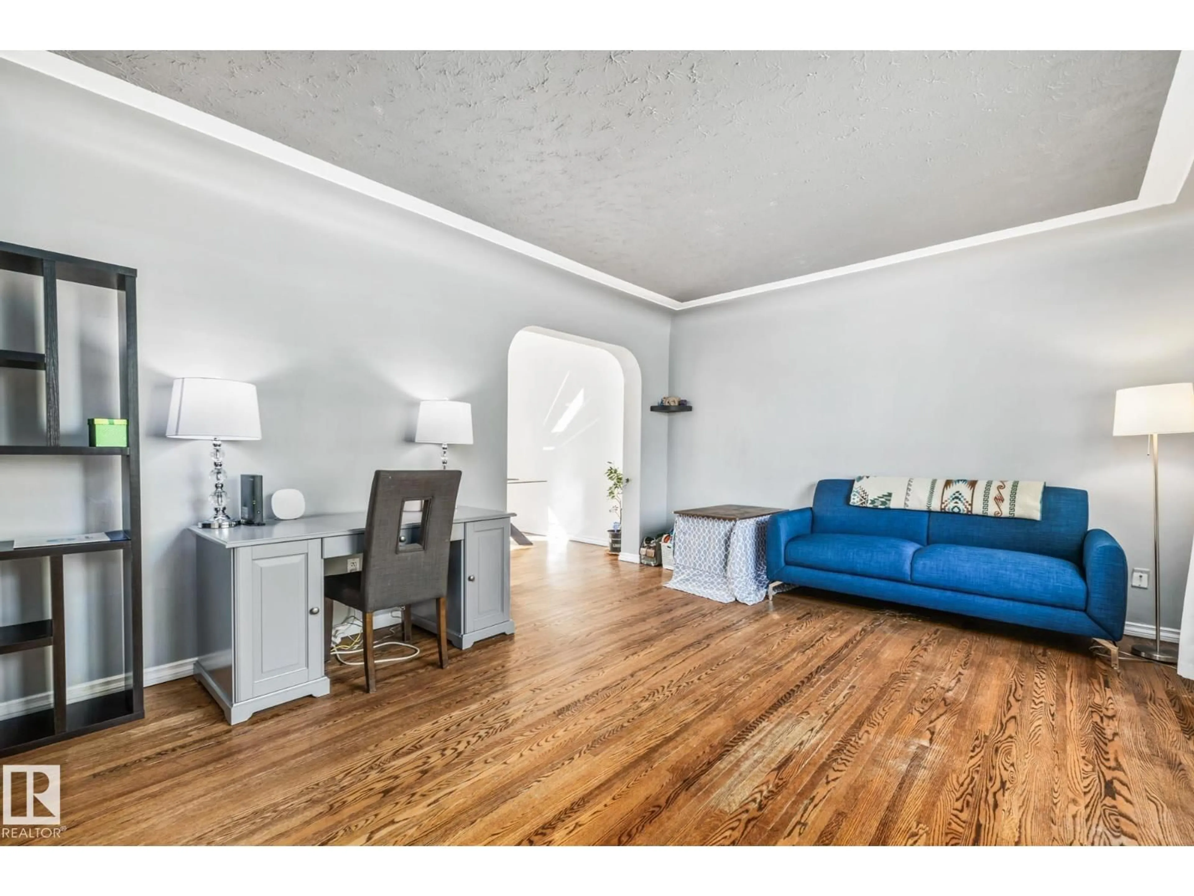 Living room with furniture, wood/laminate floor for 13647 122 AV, Edmonton Alberta T5L2W1