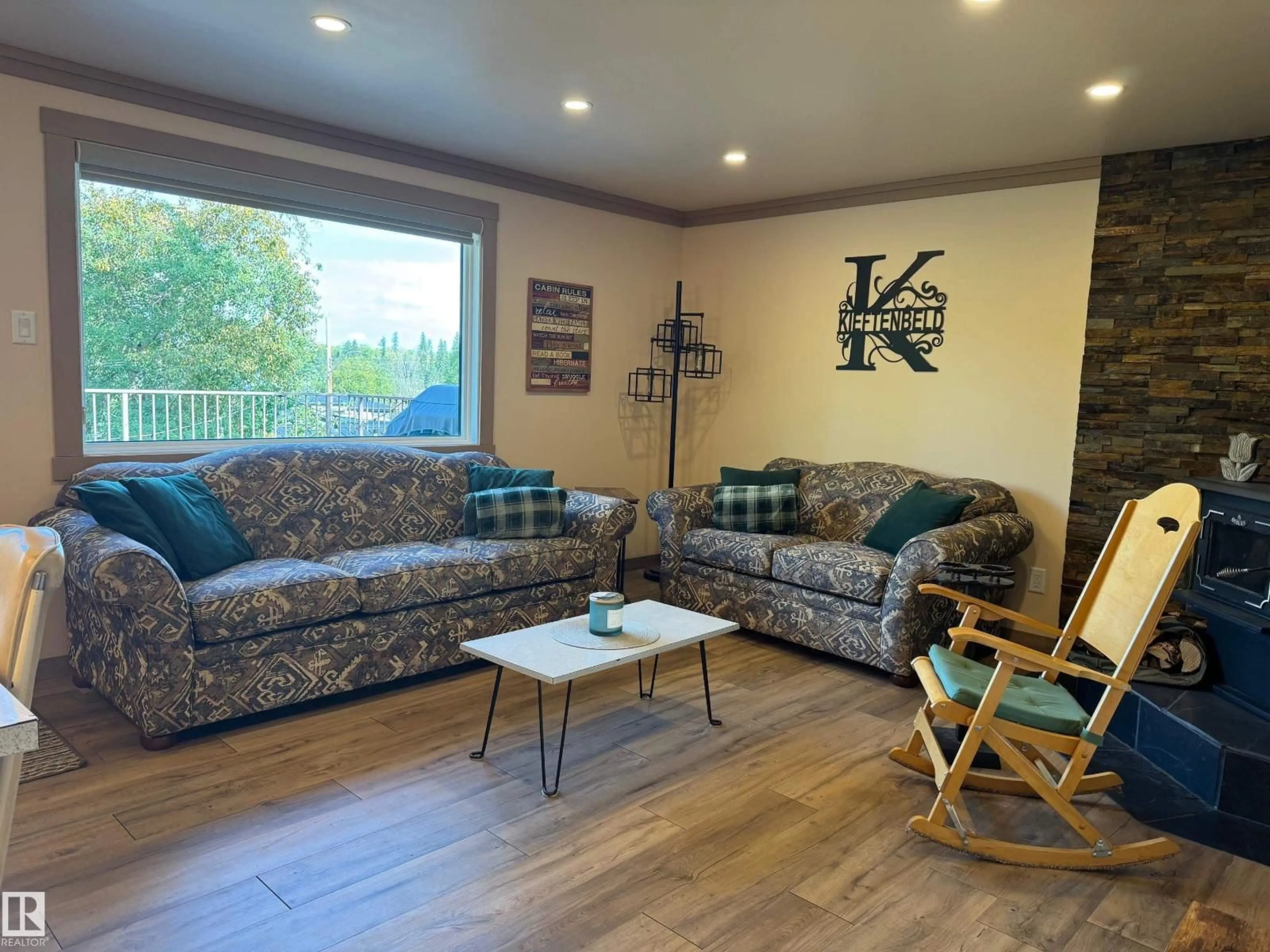 Living room with furniture, wood/laminate floor for 220 LAKESHORE DR, Rural Athabasca County Alberta T9S1S2