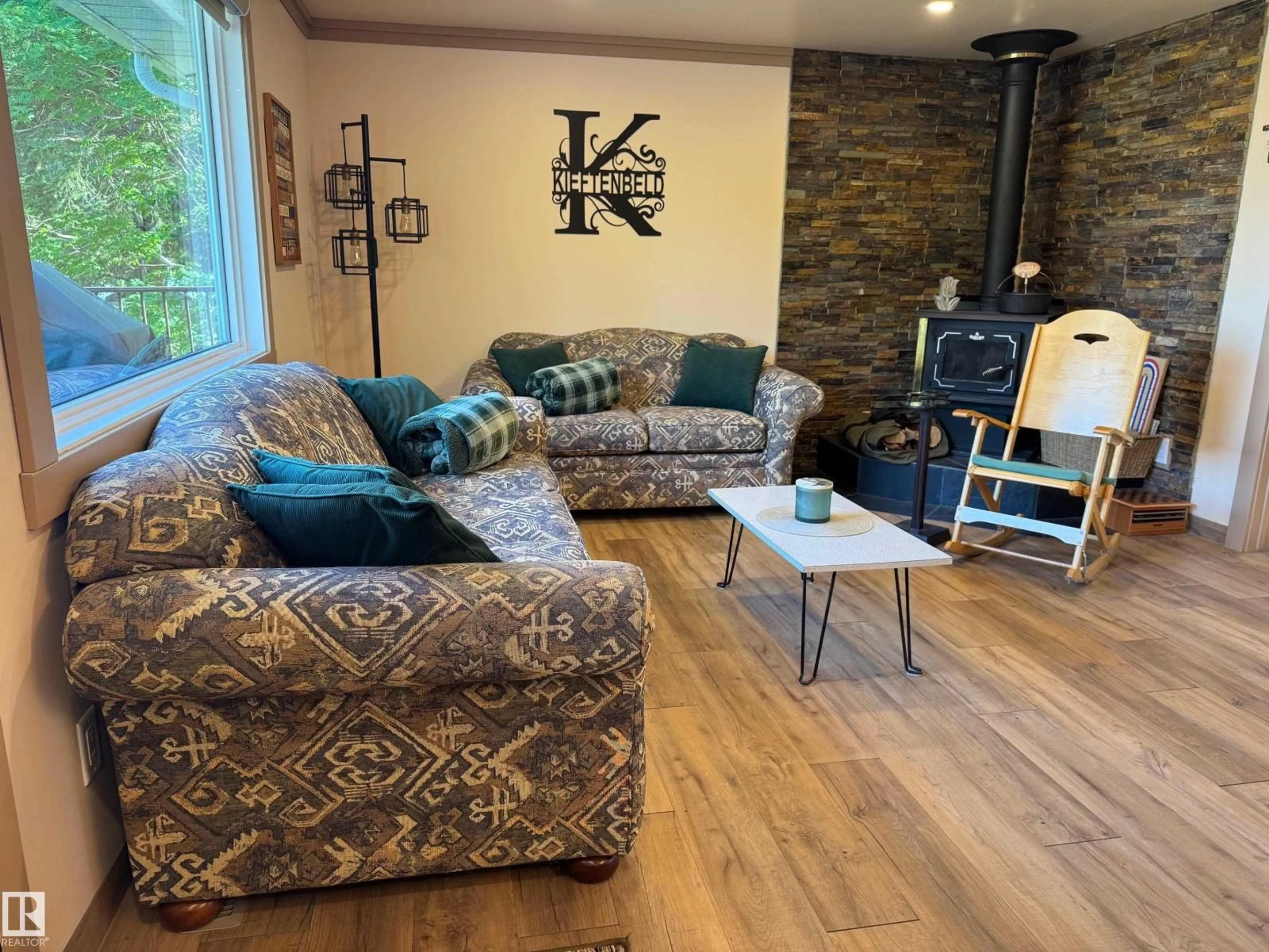Living room with furniture, wood/laminate floor for 220 LAKESHORE DR, Rural Athabasca County Alberta T9S1S2