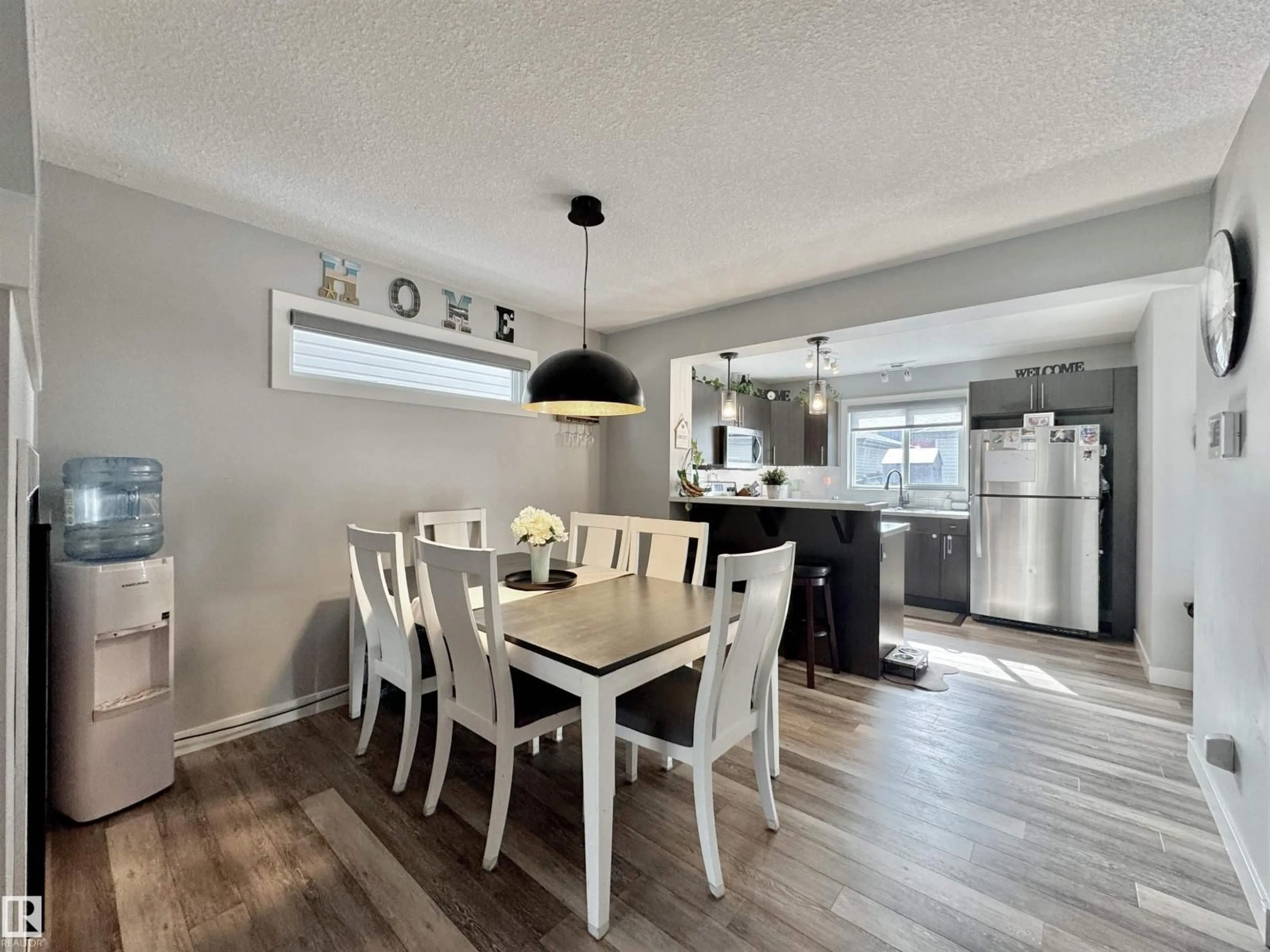 Open concept kitchen, wood/laminate floor for 189 RADCLIFFE, Fort Saskatchewan Alberta T8L0S8