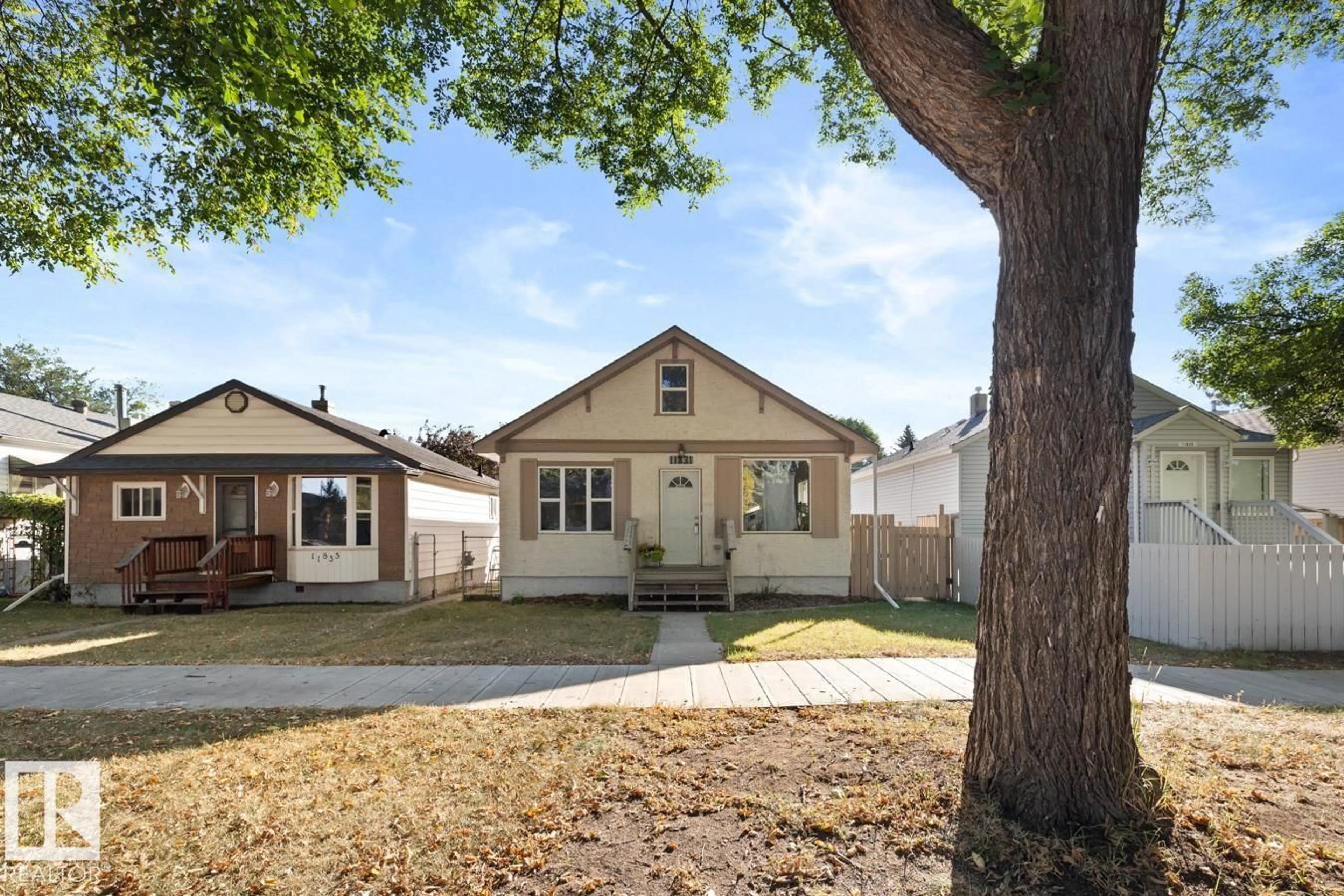 Home with vinyl exterior material, street for NW - 11831 69 ST, Edmonton Alberta T5B1S2