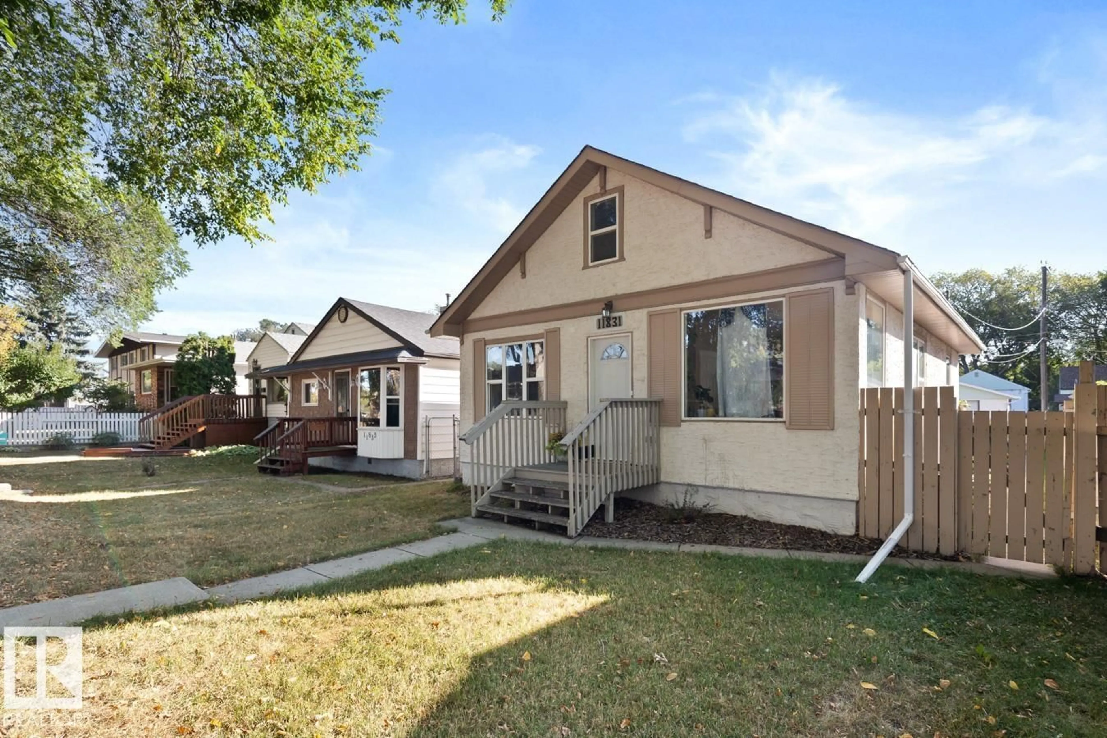 Home with vinyl exterior material, street for NW - 11831 69 ST, Edmonton Alberta T5B1S2