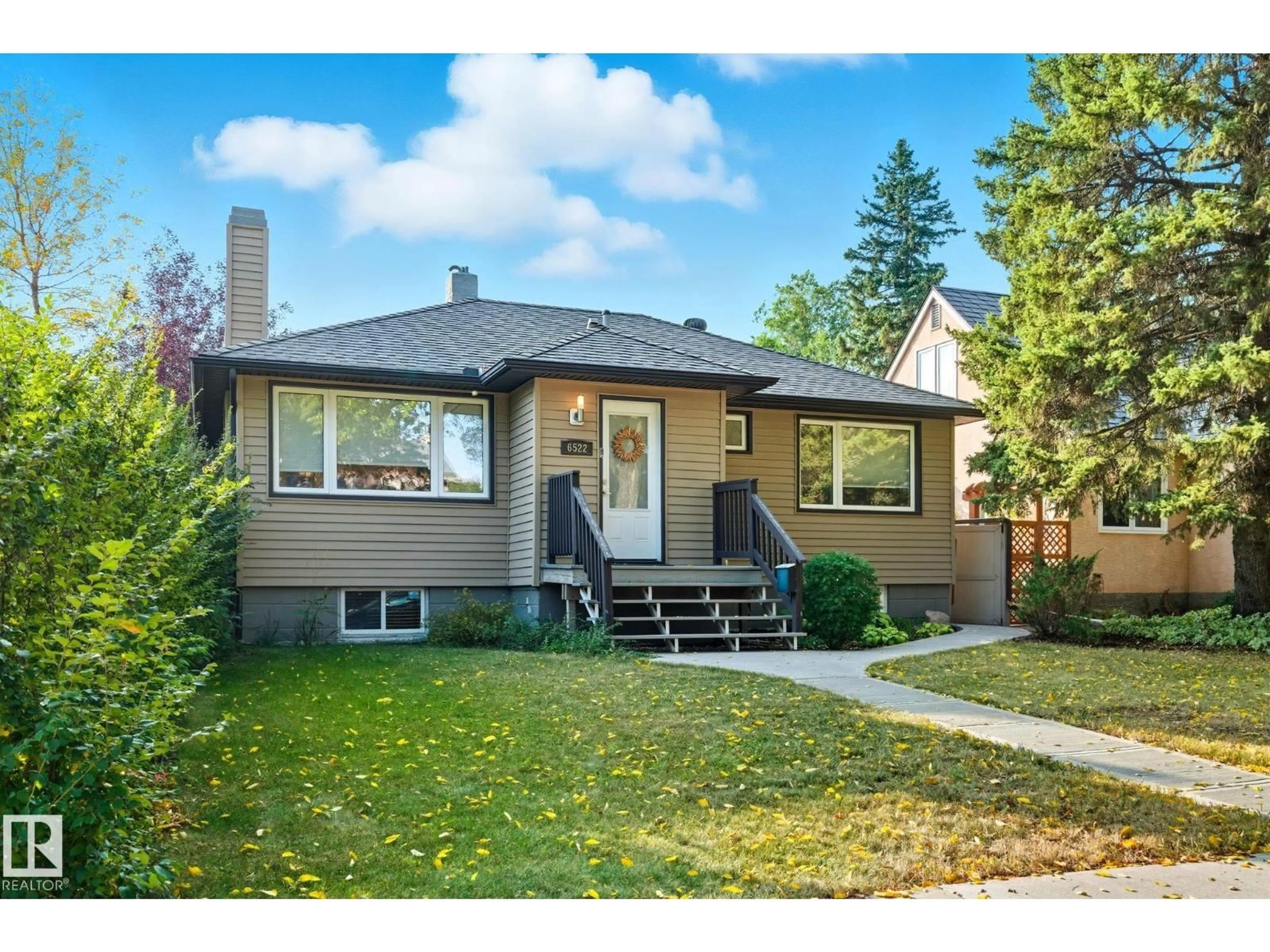 Home with vinyl exterior material, street for 6522 112A ST NW, Edmonton Alberta T6H4R3