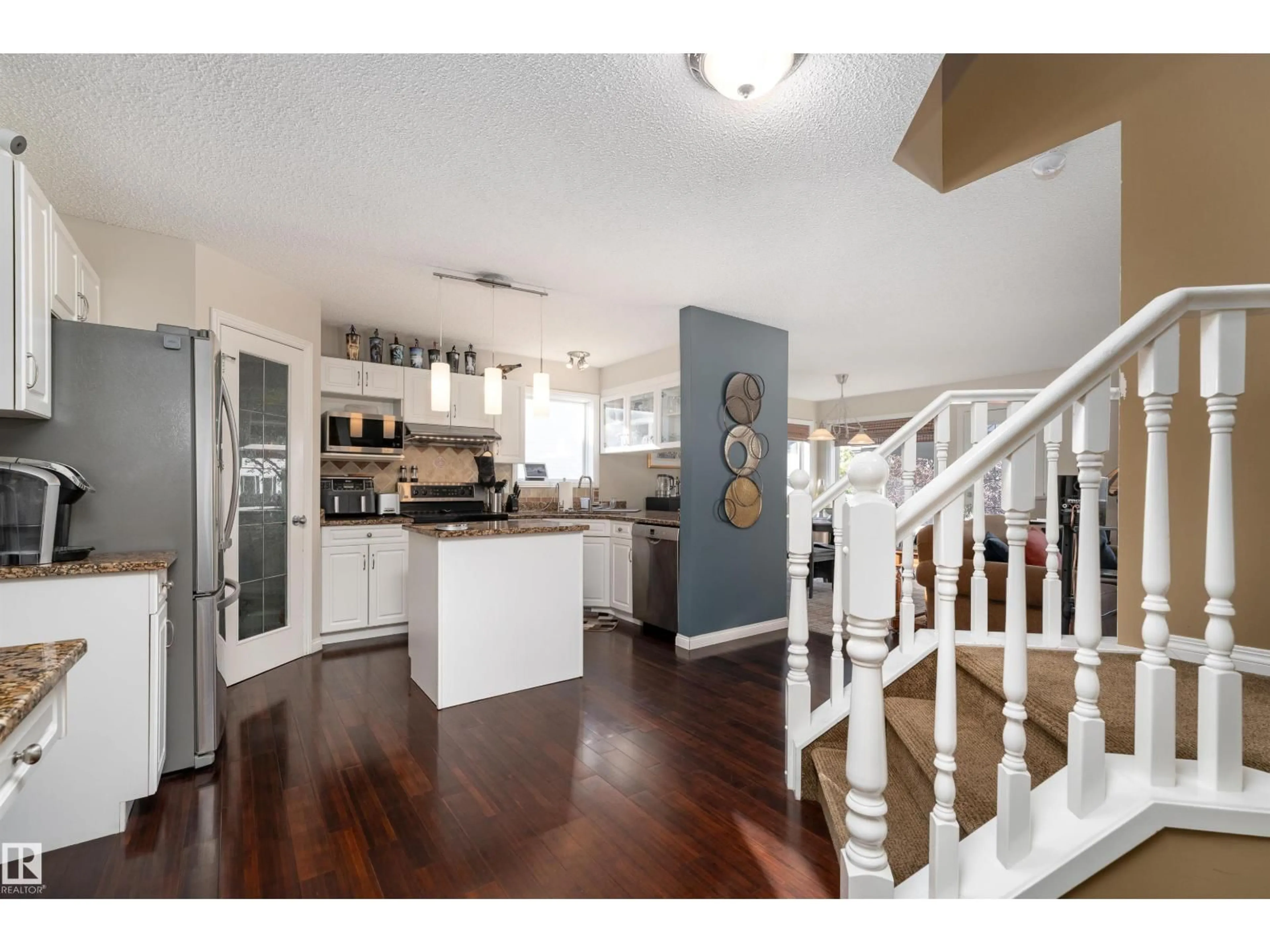 Open concept kitchen, wood/laminate floor for 2168 37B AV, Edmonton Alberta T6T1R6