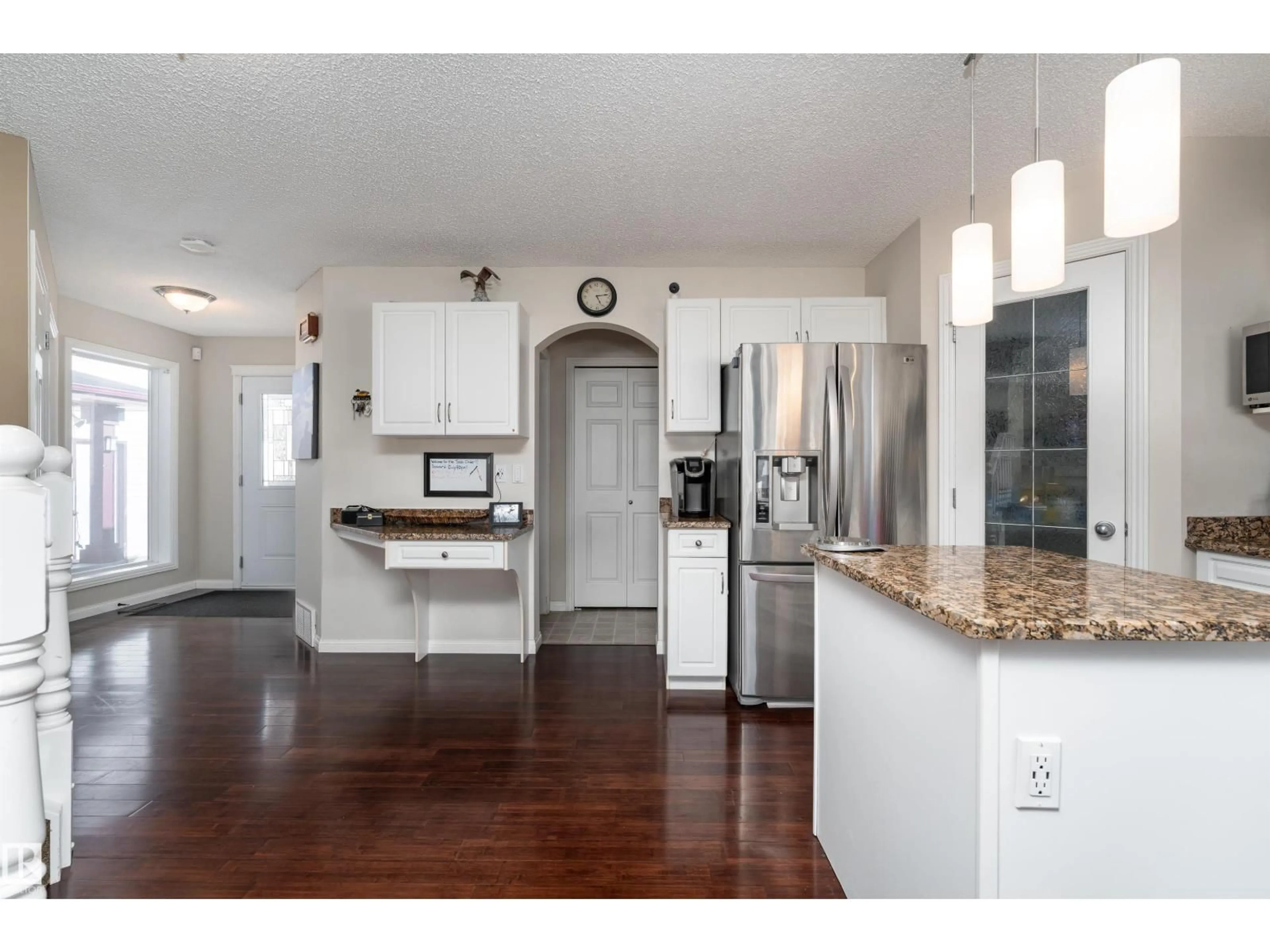 Open concept kitchen, wood/laminate floor for 2168 37B AV, Edmonton Alberta T6T1R6