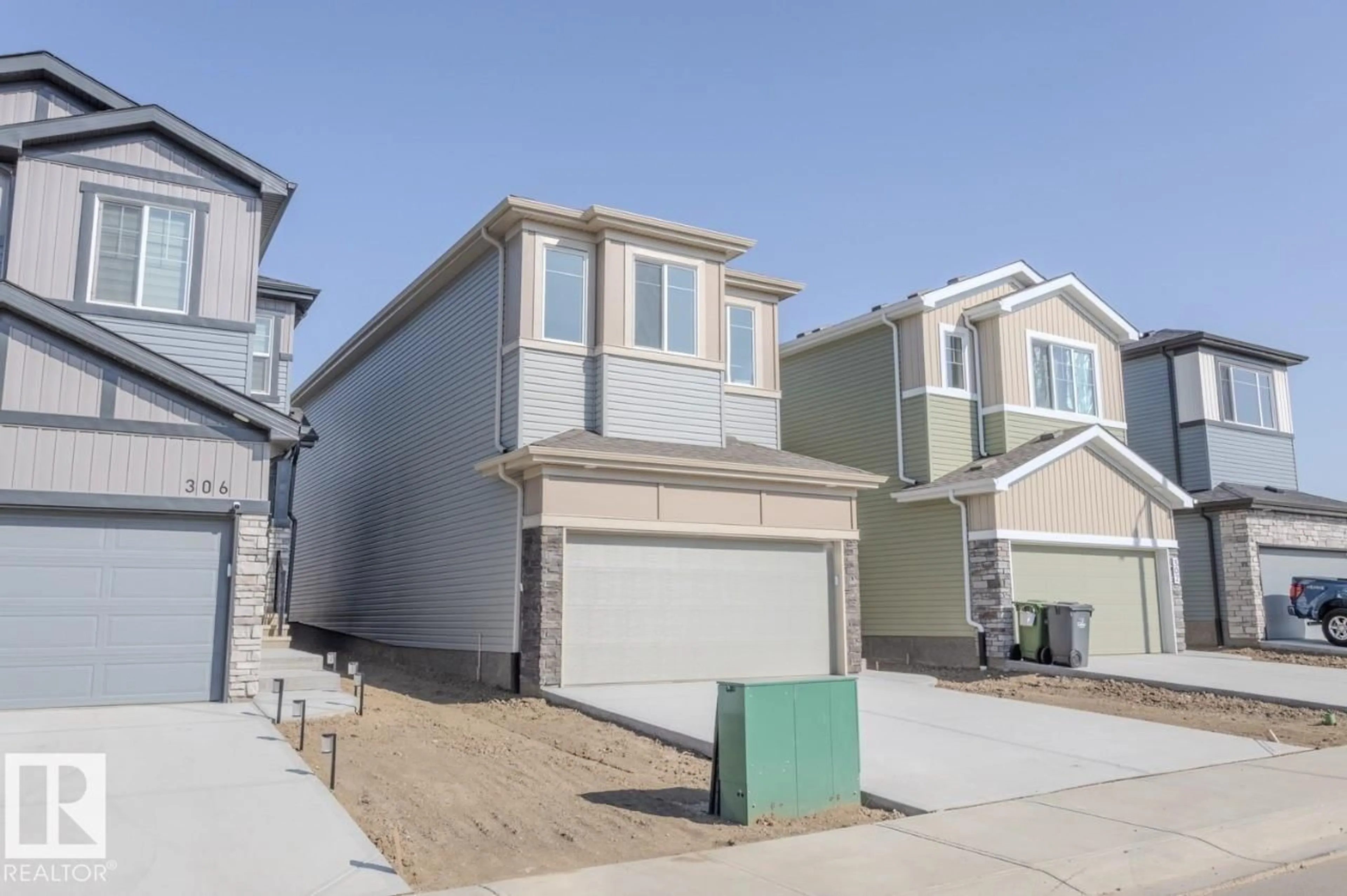 Home with vinyl exterior material, street for 304 JUNIPER CV, Leduc Alberta T9E1S7