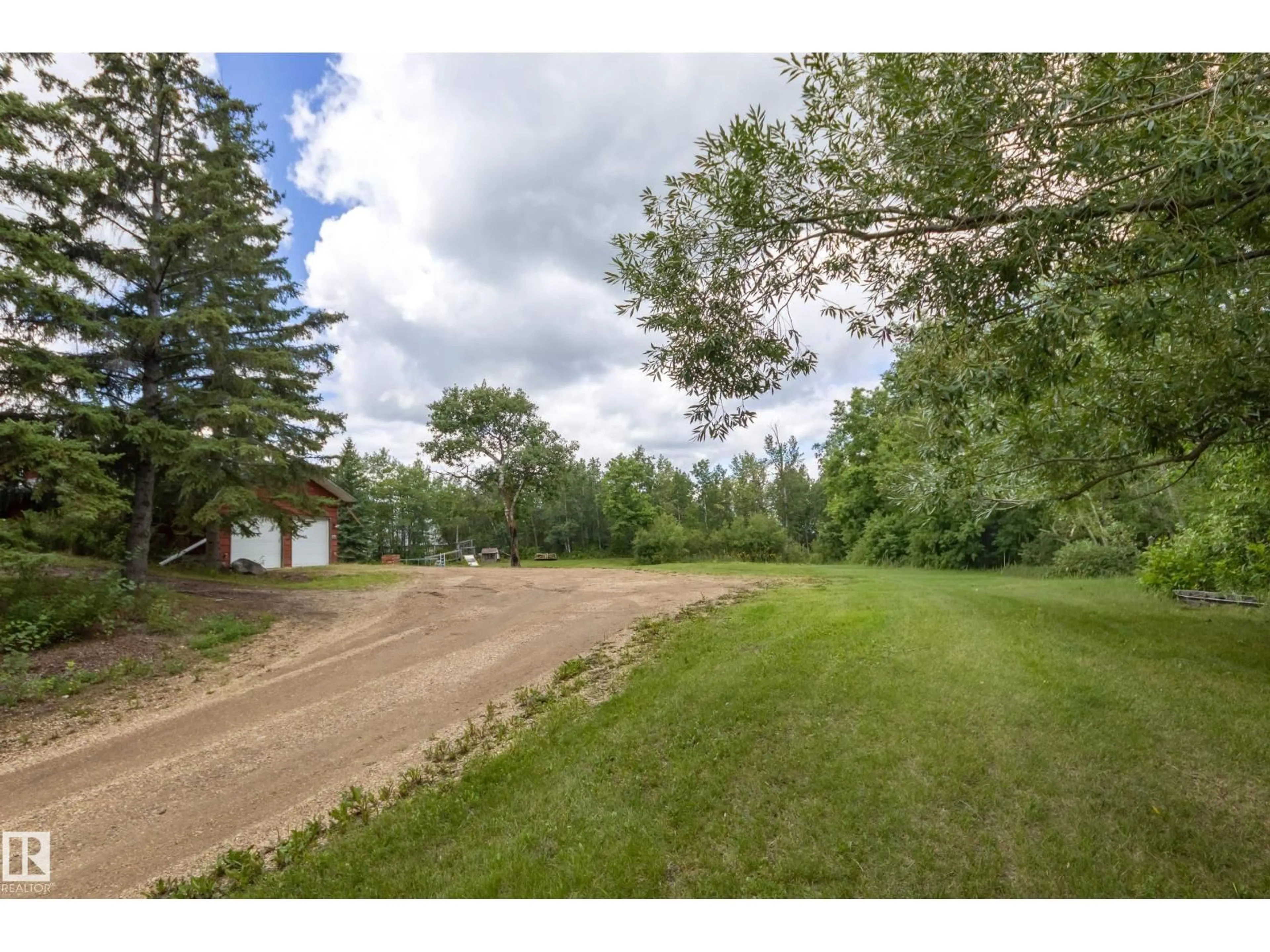 A pic from outside/outdoor area/front of a property/back of a property/a pic from drone, street for 253 - 52152 RGE ROAD 225, Rural Strathcona County Alberta T8C1C6