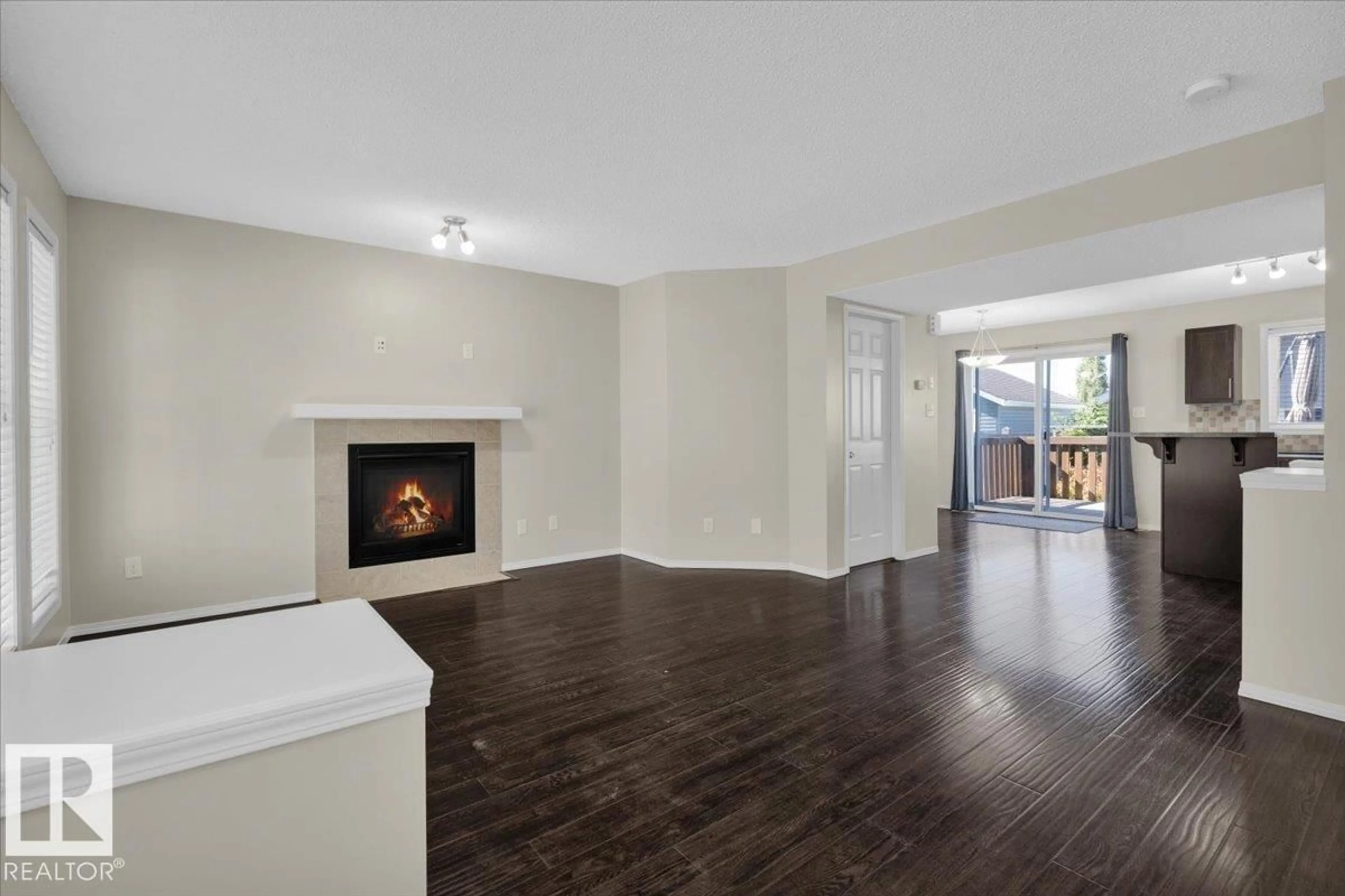 Living room with furniture, wood/laminate floor for 9128 SHAW WY, Edmonton Alberta T6X0S4