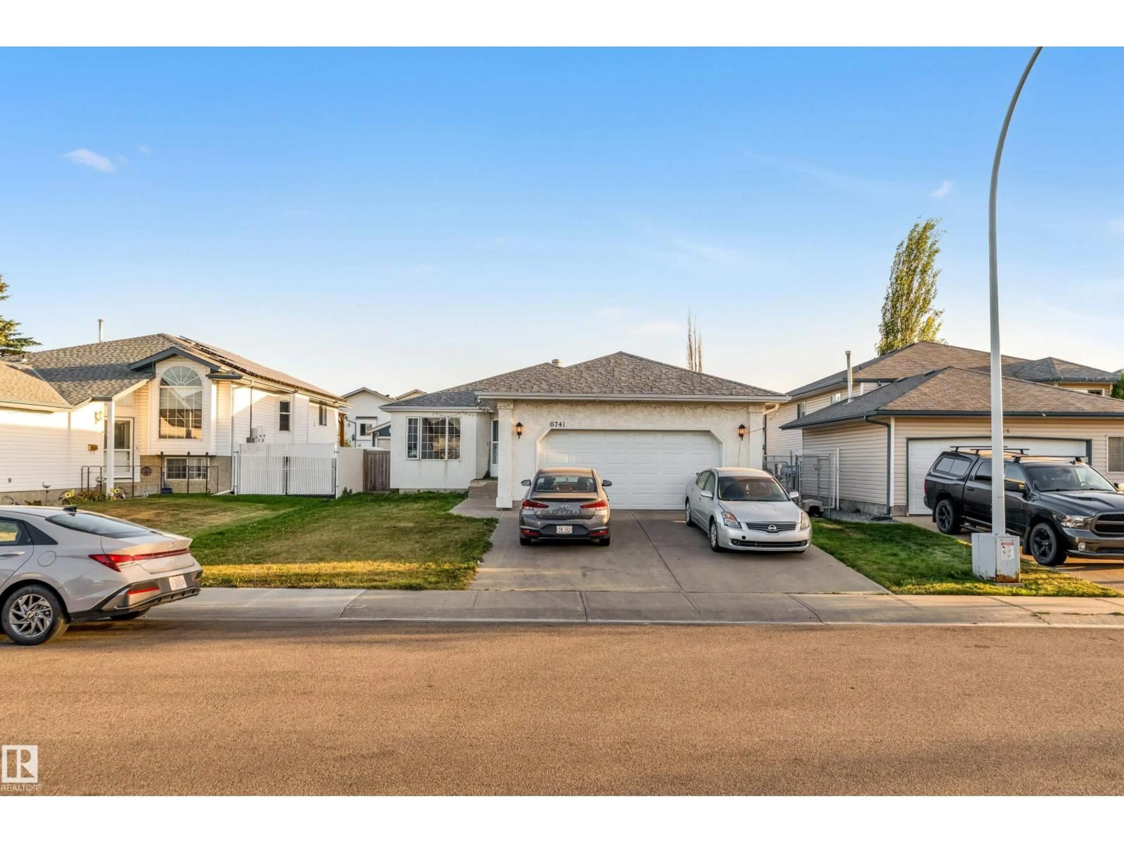 Home with vinyl exterior material, street for 6741 162A AV, Edmonton Alberta T5Z3C6