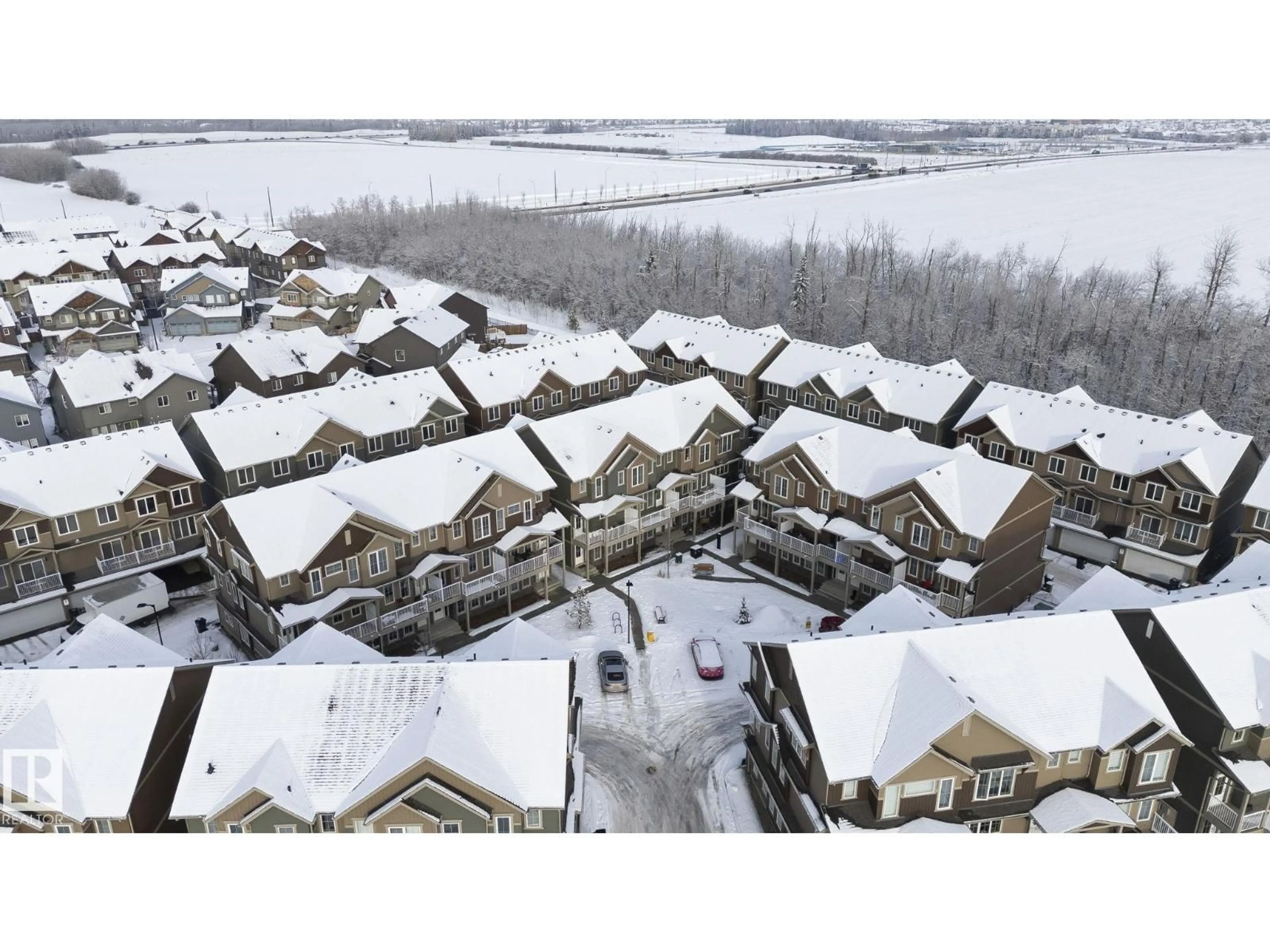 A pic from outside/outdoor area/front of a property/back of a property/a pic from drone, mountain view for 1051 GRAYDON HILL BLVD, Edmonton Alberta T6W3C8