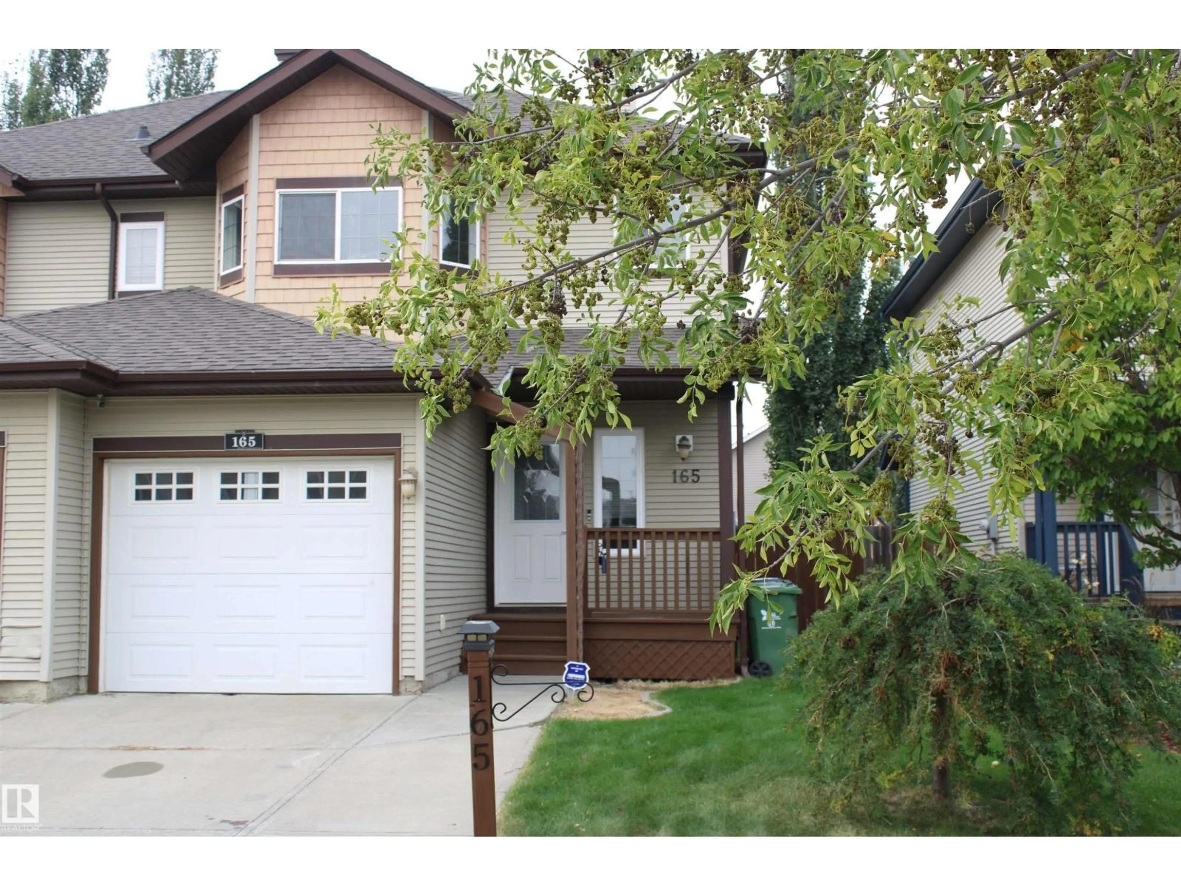 Home with vinyl exterior material, street for 165 RUE MAGNAN, Beaumont Alberta T9E6A8