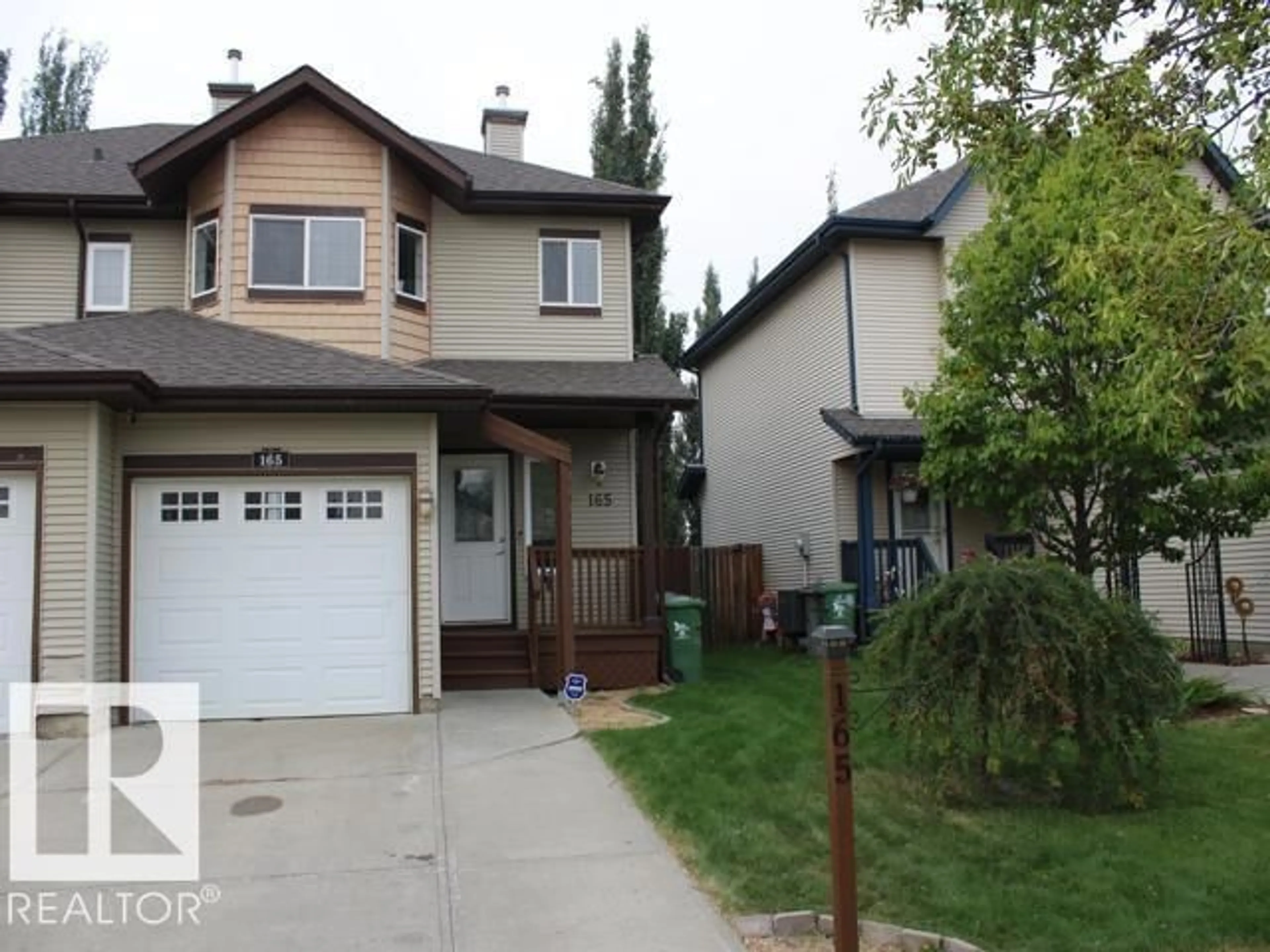 Home with vinyl exterior material, street for 165 RUE MAGNAN, Beaumont Alberta T9E6A8