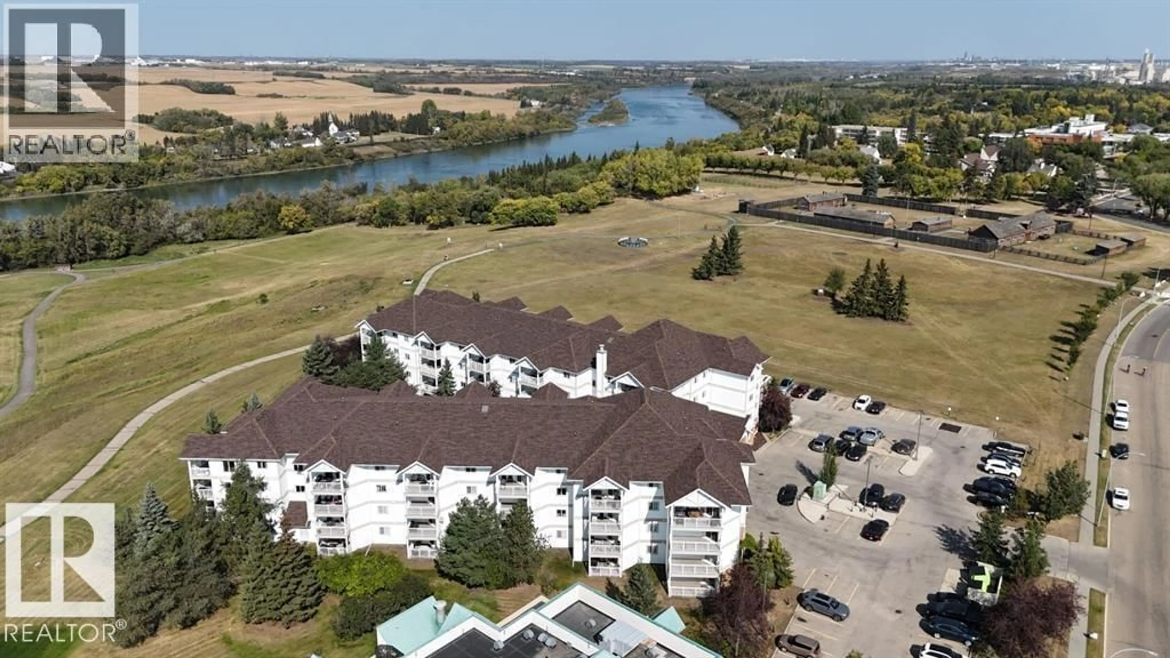 A pic from outside/outdoor area/front of a property/back of a property/a pic from drone, water/lake/river/ocean view for 110 9932 100 AV, Fort Saskatchewan Alberta T8L4P3