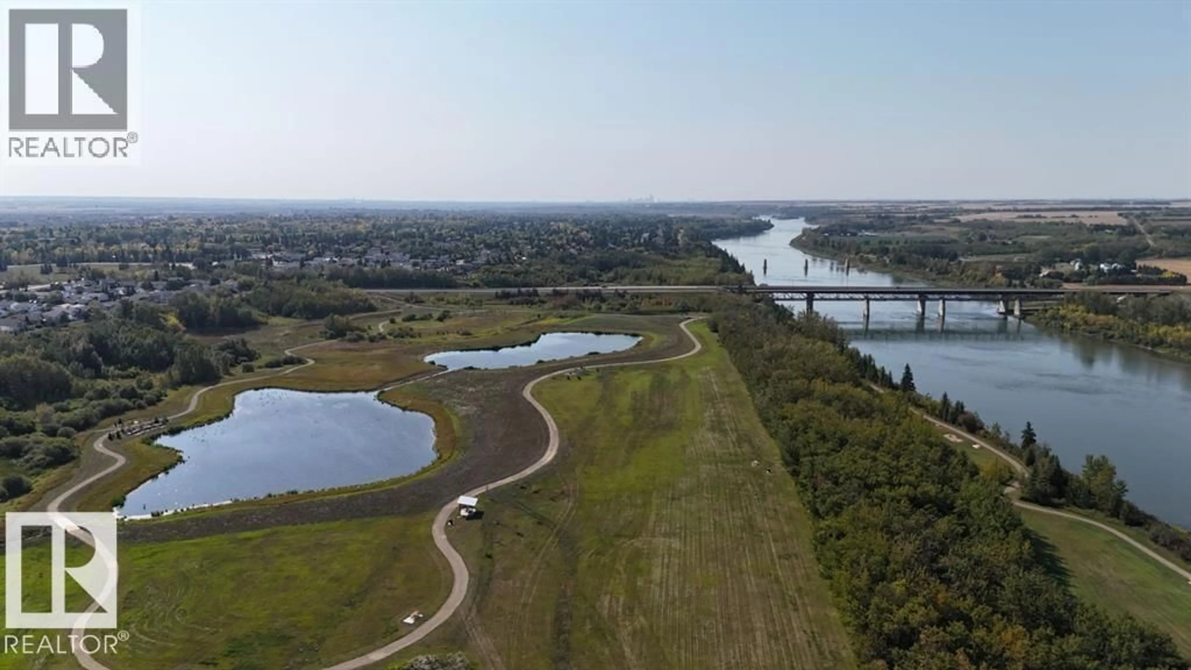 A pic from outside/outdoor area/front of a property/back of a property/a pic from drone, water/lake/river/ocean view for 110 9932 100 AV, Fort Saskatchewan Alberta T8L4P3