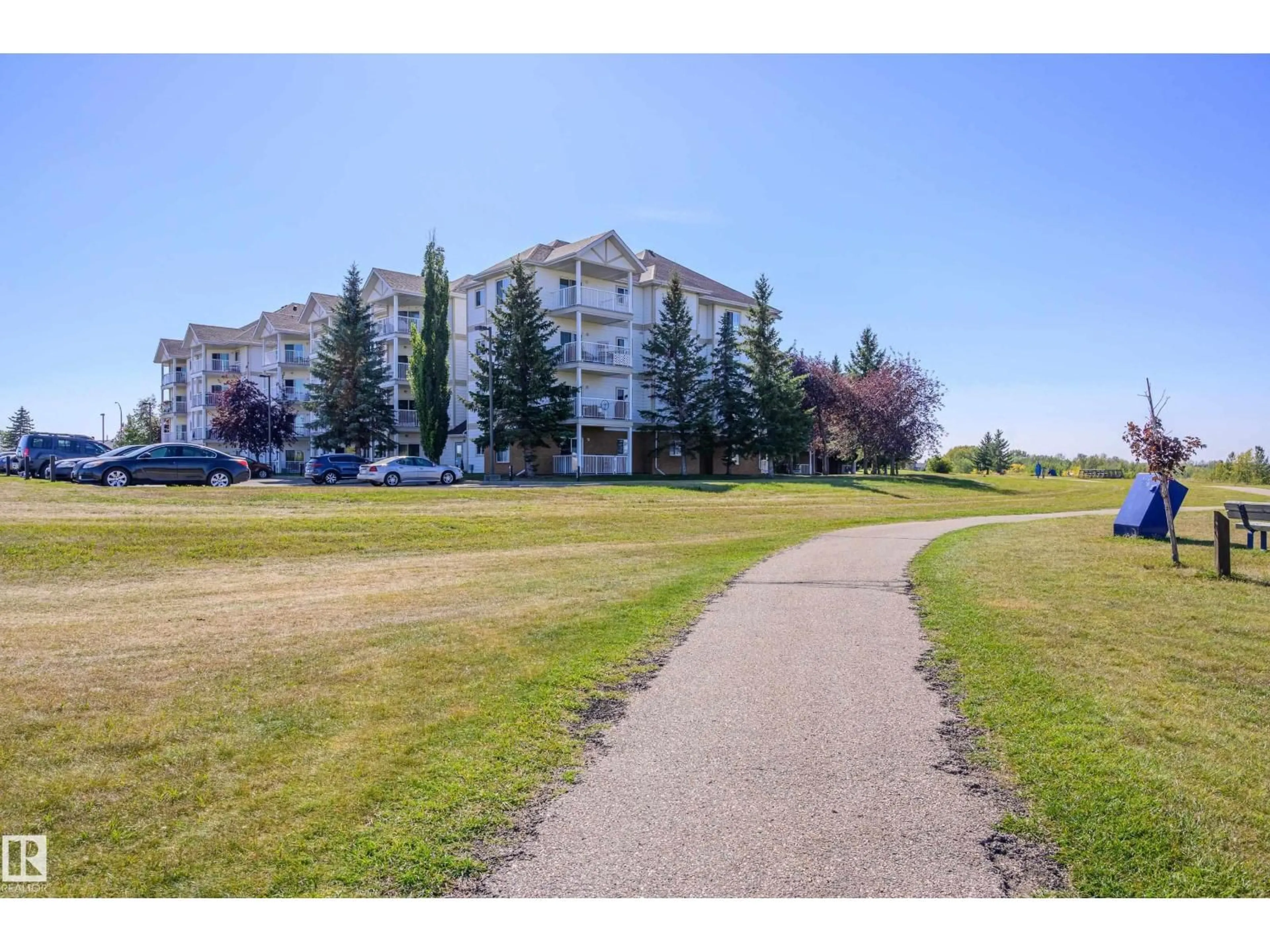 A pic from outside/outdoor area/front of a property/back of a property/a pic from drone, water/lake/river/ocean view for 110 9932 100 AV, Fort Saskatchewan Alberta T8L4P3